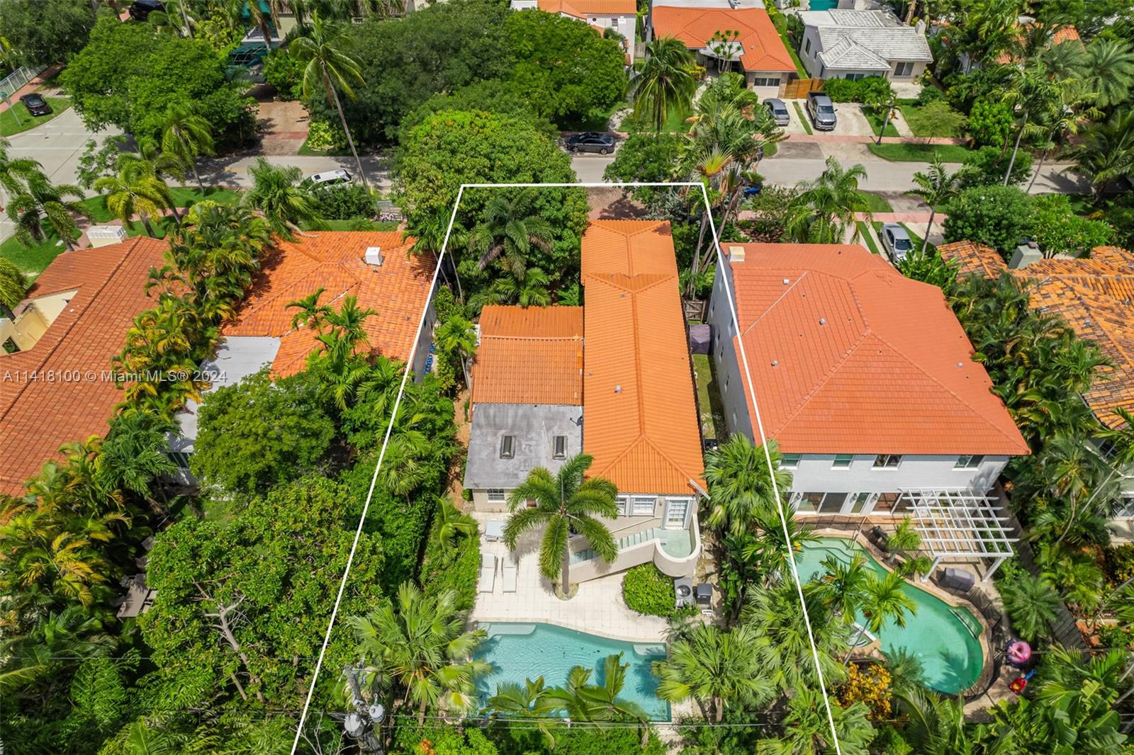 This spacious Miami Beach home with historic charm has 3,305 Sqft. under air. Enter through a tranquil butterfly garden & feel right at peace. This spacious open floor plan with lots of natural light with skylights has four bedrooms and four bathrooms. Vaulted ceilings with exposed original beams centered around a beautiful fireplace in the large formal dining room. Remodeled eat in kitchen with island. The private owners suite with renovated ensuite has an attached bonus room area with a private entrance. Ample closet and storage space. Entertain in this private backyard oasis with a newly resurfaced pool. Multiple zone, energy efficient A/C systems. Never lose power. Full home natural gas generator. Tesla charging station. Minutes to all that Miami Beach has to offer.