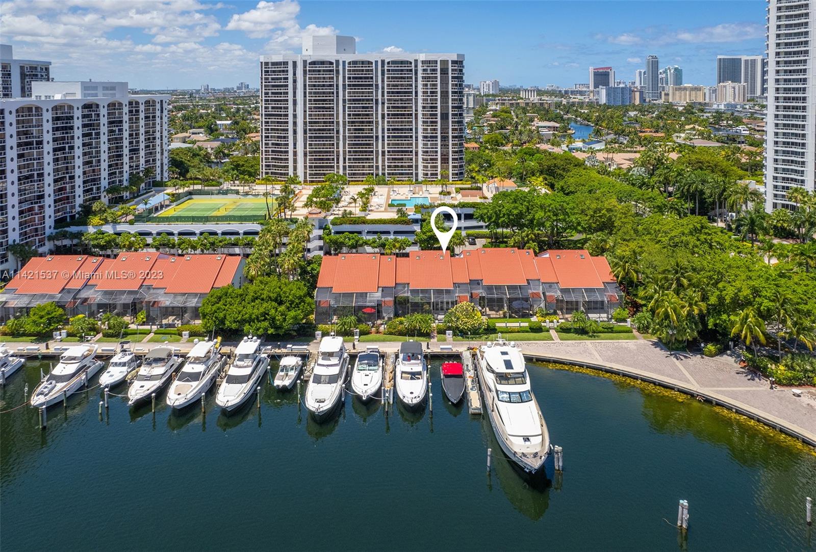 Experience the captivating charm of this waterfront townhome nestled in the vibrant heart of Aventura tucked away in the gated community of Portsview. Residence boasts open water views overlooking marina, breathtaking sunsets, garage and a private south-facing backyard for year-round sunshine.  Remodeled townhome features all impact windows/doors and light-filled modern interior. With 2BR/2.5BA, an open all white kitchen, dining area, and a cozy family room, this home offers a perfect blend of comfort and style, complemented by thoughtful improvements such as motorized blinds, French doors, custom epoxy coated garage, wall treatments and more.  Nestled between Miami and Fort Lauderdale with shops, dining and entertainment nearby, enjoy the low maintenance lifestyle of townhome living.