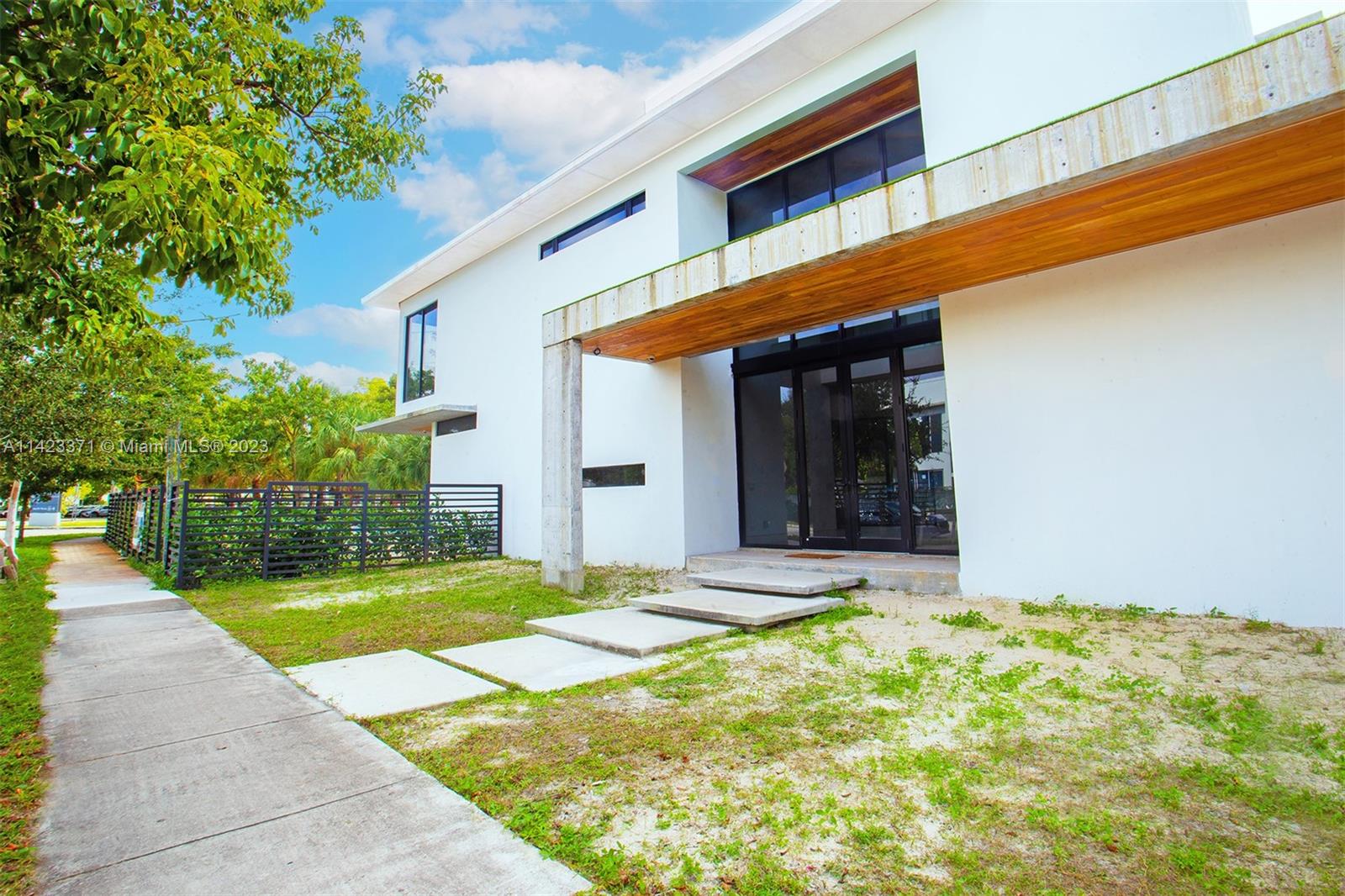 Introducing the stunning 2023 New Construction with a pool, featuring beautiful architecture with floor-to-ceiling windows. This modern gem in the Roads Neighborhood offers 5 beds, 6 baths. First-floor guest bath with yard access, cabana style. 48x48 porcelain floors and light oak wood flooring in bedrooms. Master Bedroom boasts open concept, his and her toilets, sinks, and closets. Corner lot, one neighbor. Large terrace with family room view. Artful wood finish stairs with glass railings. Abundant natural light. Customizable kitchen for the perfect culinary oasis.