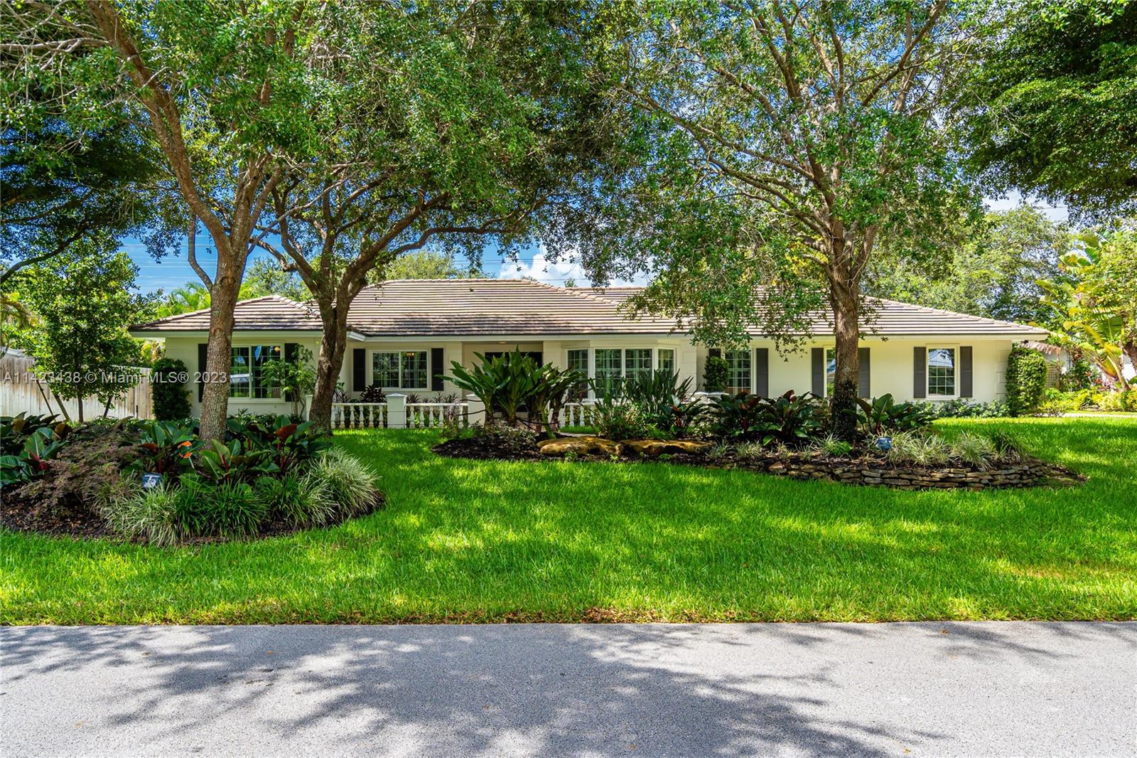 Exquisite 5-bedroom home built by Hollub in sought-after North Palmetto Bay. Meticulously updated, this home boasts top-of-the-line features, including impact windows/doors, travertine driveway and 3-year old roof. Spacious interior layout, formal living, dining, and family rooms with marble floors, and nice size bedrooms. Gourmet kitchen, granite counters, high-quality appliances. Tranquil backyard oasis, with screened in pool with natural stone waterfall and a generous covered patio with views of the extensive gardens. Half acre lot, mature trees and fire pit ideal for outdoor gatherings. Minutes from Old Cutler Rd, top-rated schools, Deering Estate, parks, restaurants & shops. Embrace elegance and comfort in Palmetto Bay!