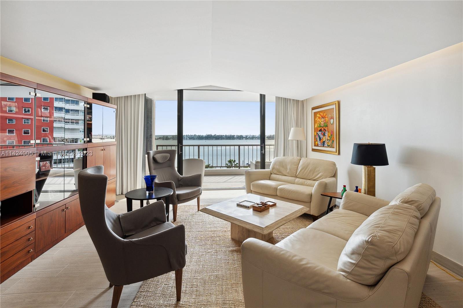 Step into this rarely available 02 line, 2 bed + den / 2 bath with direct bay views in the exquisite Villa Regina Condominium. With 1,795 SF of living space and a 215 SF veranda, you will enjoy unobstructed water views from every room. Kitchen features lots of storage space, granite countertops, and wood cabinets plus a charming breakfast nook. Building has excellent amenities including state-of-the-art fitness center and spa, outdoor pool and jacuzzi, clubroom, children's playroom, valet for residents and visitors, and much more. Residents also have a private marina dock available to rent or purchase. Ready to make this your new home? Call us today to schedule a private showing!