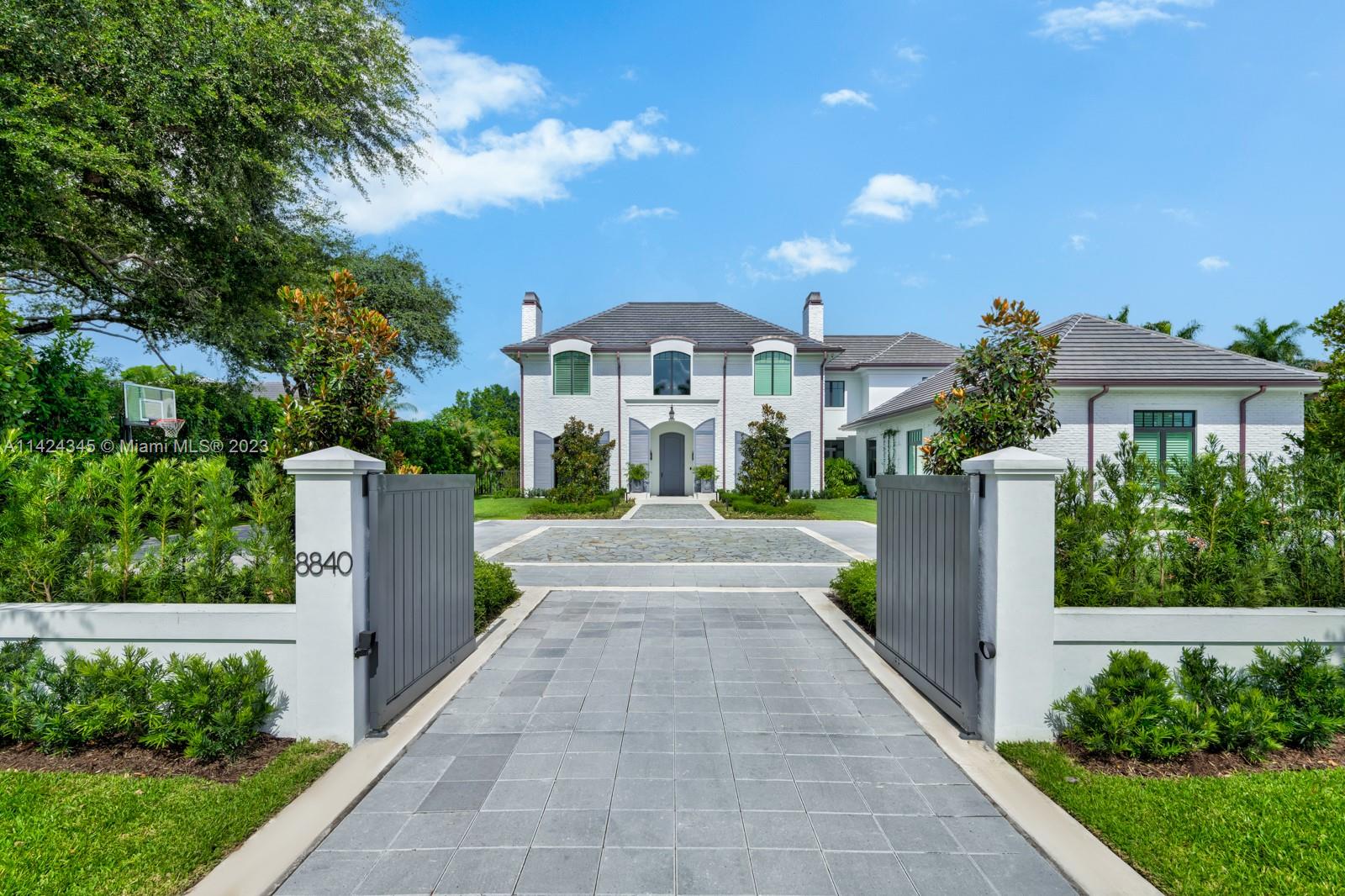 Welcome to this stunning home in N. Pinecrest. This Classic European design exudes elegance and sophistication. 7 beds & 7.5 baths, formal living w/bar and 380+ temp. controlled wine cellar, family rm w/surround sound, breakfast rm for informal daily use, formal dining and butler’s pantry for traditional dinner parties. A showstopper kitchen features a custom L’atalier Paris range, quartzite tops, hidden appliance cabinet, commercial grade exhaust. A whole-house 80 kW generator, elevator, tankless gas water heaters with circulating pump, and Smart-home system.  A/C in 4-car garage with room for a car lift. The backyard is perfect to enjoy the outdoors, shallow pool and hot tub, a cool misting system in the covered loggia, Full summer kitchen and plenty of space for entertaining year-round.
