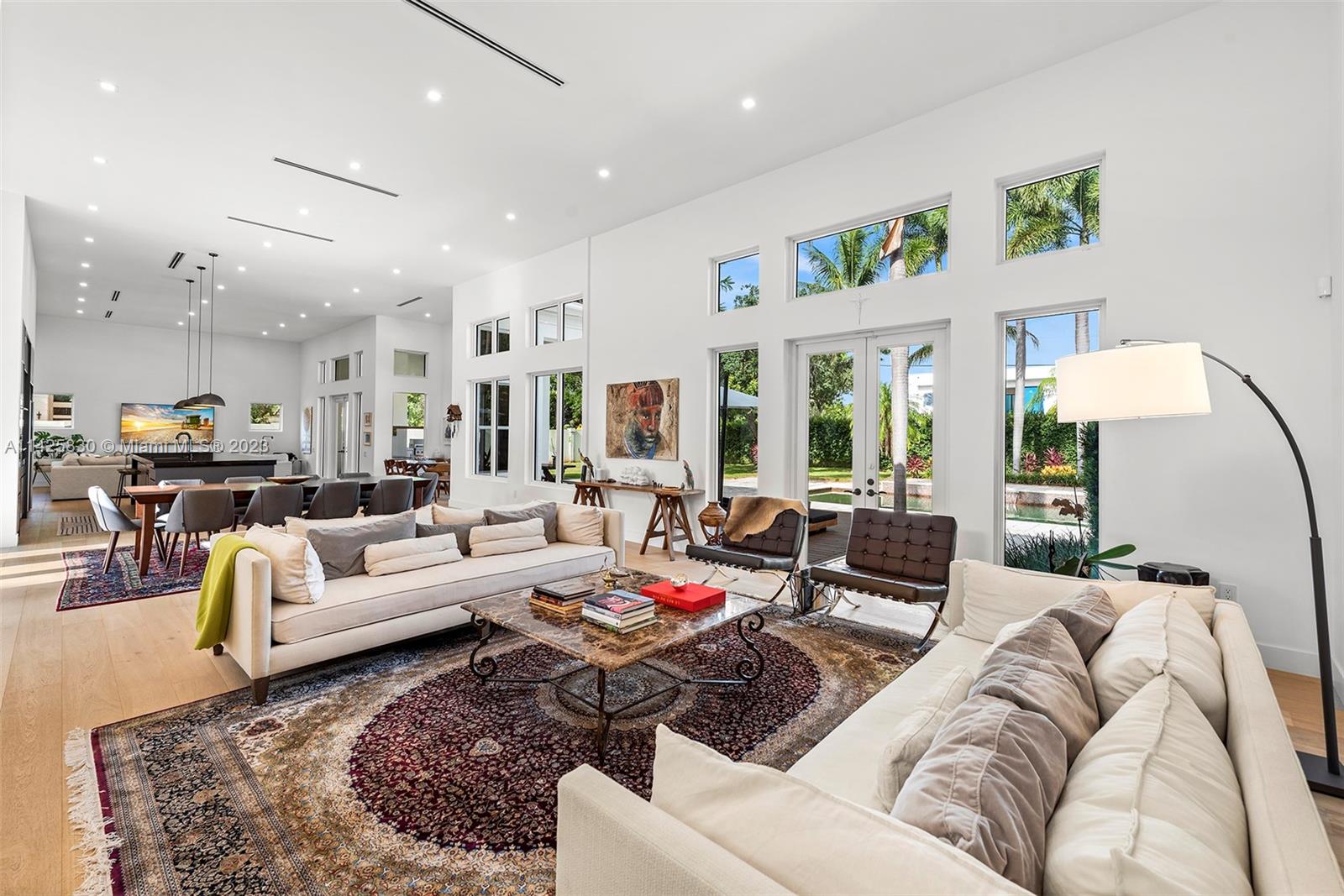Located in the Sanctuary Pinecrest, a 12-home gated community next to Pinecrest Gardens, this gorgeous residence is a rare find! Prepare to be WOWed upon entering the jaw-dropping great room w/ volume ceilings, wood floors & modern, open-concept kitchen outfitted w/ SubZero & Wolf appliances. Expertly finished by architect-owner blending modern & warm design, guests will find each space carefully curated. Spacious & private primary suite comes w/ office, lavish bath & 2 walk-in closets. This amazing resort-style property on almost an acre also features 4 more bedrooms w/ en-suite baths, powder bath, cabana bath, a large backyard w/ pool, covered patio, 2-car garage, laundry rm, impact windows/doors & full-home generator. Highly-rated schools. 4-Pt & Wind Mitigation inspections available.