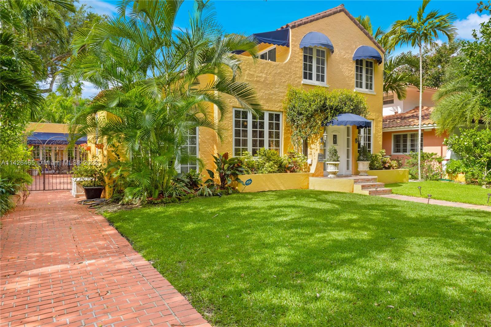 Two-story Old Spanish home with modern luxuries awaits you on charming Asturia Ave. The property features a 3 bedroom, 3 bath home and separate 1 bedroom, 1 bath guest house with large party room perfect for entertaining family and friends. All new Brazilian cherry wood floors compliment the elegant architecture, spacious formal rooms, and wood burning fire place within. New light fixtures and updated electrical system throughout the home, including smart lights, enhance everyday comfort. Updates also include a brand-new kitchen complete with new appliances, new gutters, irrigation, and plumbing system. The charming outdoor living space features a new terrace and awnings, delightful water fountain, and gorgeous landscaping for a private space to relax or entertain