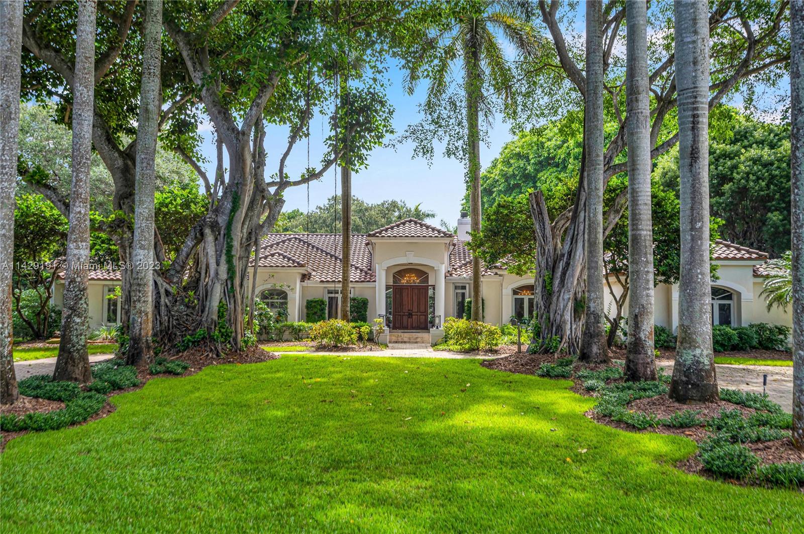 Luxurious one story estate located on the most charming and picturesque street in North Pinecrest. This custom built residence boasts 6 Beds 5 ½ Baths, large kitchen w/ island, huge family room formal dining room, elegant living room, gym & oversized 3-car garage complete w/ charging station. Sits on 1.2 acres w/ 5,576SF LA it has multiple areas to relax & entertain. The open main living spaces have high ceilings, pool & garden views. French doors open out onto a magnificent garden laden w/ fruit trees and flowering plants making it a perfect setting to entertain. Nestled off the secluded backyard is a sparkling saltwater pool & jacuzzi, summer kitchen with outdoor dining a perfect setting for parties, large or small w/ plenty of room for tennis/pickle ball court. A home that has it all.