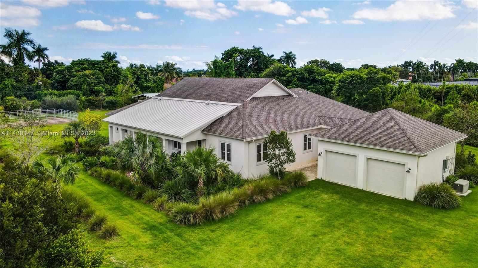 Gorgeous New Construction Custom Modern 1 story Home completed 2020 on almost 5 acres. Impact windows &
doors, Tall Ceilings, High Quality Material w/Porcelain plank flooring throughout, Flexible Open Floor plan, 2nd
living room has closet & Ensuite Bath (could be 2nd Master Suite). Jack and Jill 3rd & 4th Bedrooms. 5th bed is
being used as office. Quartz Kitchen w/large center island, Gas stove & Tankless Water heaters. Huge Master Bath
& Custom Closet. Large covered terrace for Entertaining. New 2 stall & tack room barn for your horses. NO HOA,
not in a flood zone. Same owner owns adjoining Nursery & 71 acres. Generator & Transfer Switch, Native Drought
Resistant Landscaping, Detached 2 car garage. Whole House USUV water filter system.