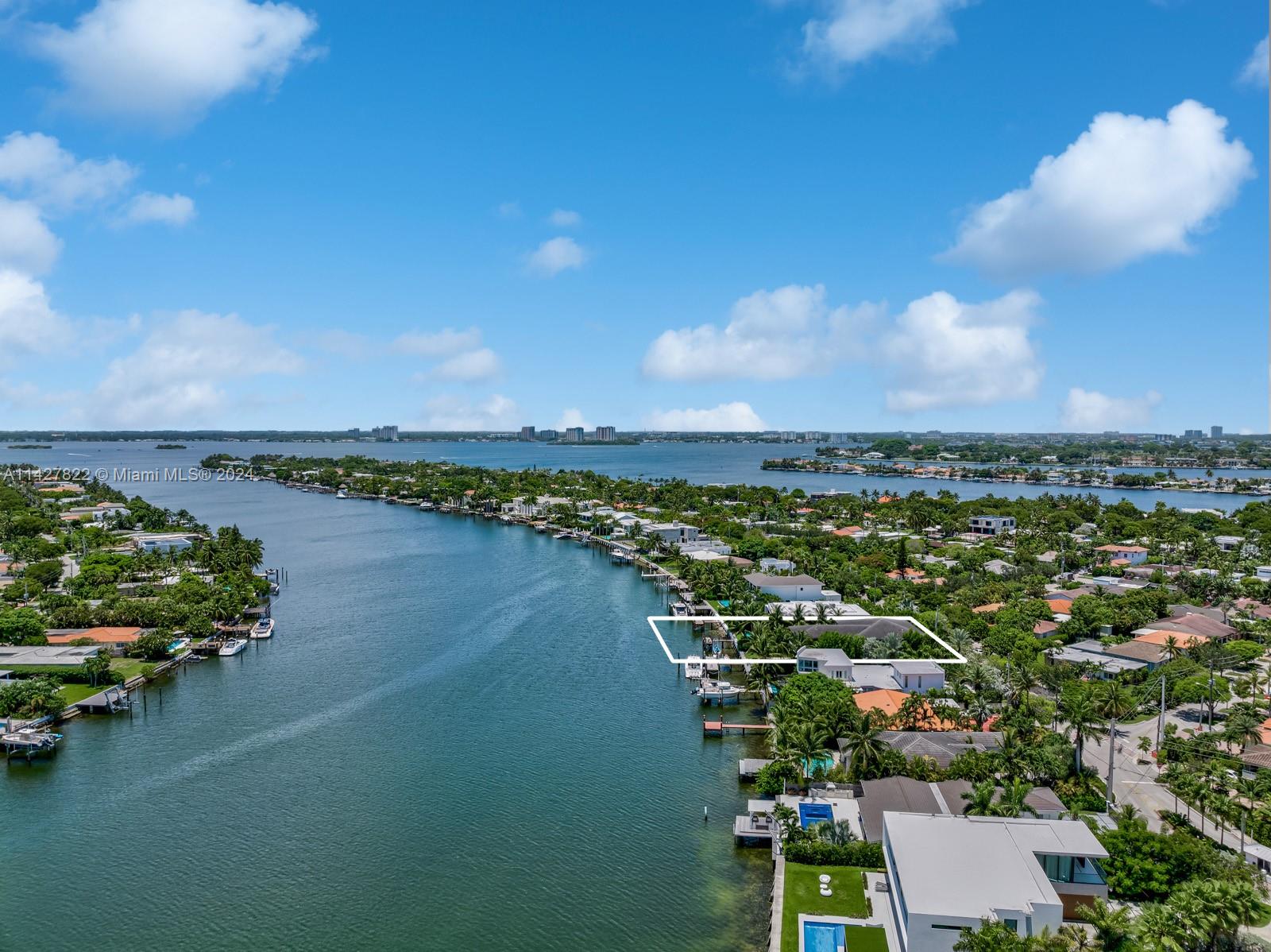 Remarkable turn-key waterfront residence located in the gated community of Biscayne Point. This exquisite 6 BD/6 BA home boasts 5,423 SF & breathtaking southwestern exposure. Upon entering you will find an open-concept layout, double-height ceilings & an abundance of natural light. The gourmet kitchen is equipped with Sub-Zero appliances, marble countertops, & an island perfect for entertaining. The primary suite is a tranquil retreat, with a spa-like ensuite bathroom & private balcony overlooking Normandy Island & the Downtown Skyline. Outside, indulge in the Miami lifestyle with a pool, spa, BBQ & patio area. 70 FT of water frontage & a dock with direct Intracoastal access make this home suitable for boaters. Just minutes from Bal Harbour Shops, beaches, upscale dining, & entertainment.