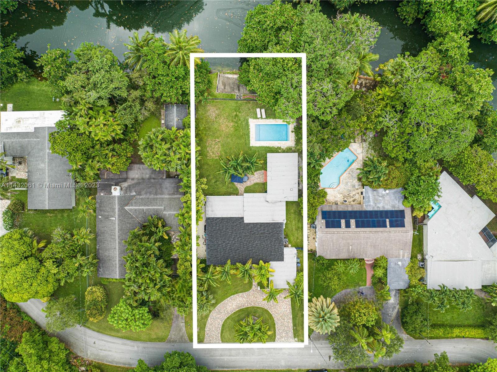 Welcome to this delightful residence in the heart of South Miami! Located in a peaceful neighborhood and low traffic street, just minutes away from shopping, dining, schools & parks, this beautiful home offers a perfect blend of modern convenience and classic charm. 4 bedrooms, 3 bathrooms, 2,137 SF living area, 12,750 SF lot overlooking the canal with private deck, large covered terrace, heated pool, all impact windows and doors, new roof, 2 AC Zones, ect. The interior boasts an open floor plan with plenty of natural light, creating a warm and inviting atmosphere. Ideal split floor plan with a spacious master suite and 3 large and sunny other bedrooms, one of them w/en-suite bath. Kitchen features real wood cabinets w/ glass front accents and gas range. Garage converted to storage.