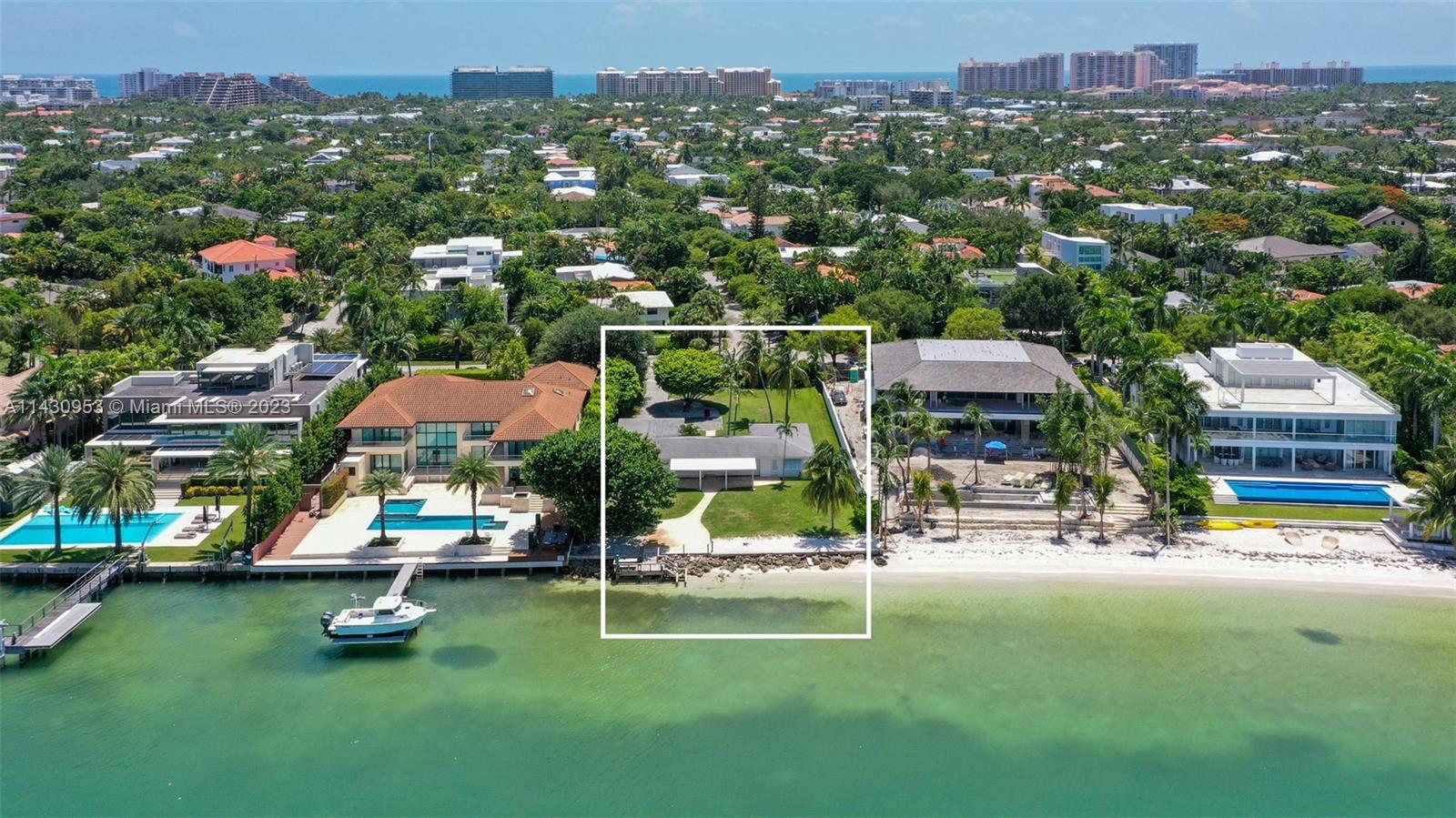 Truly a trophy property ready to be developed.The original cottage on this unique 20,933 sq. ft. lot, is nestled among some of the most coveted stately homes of Key Biscayne. It may be lived in while your new house project is ready. Watch the endless parade of boats as they cruise the shimmering waters of Biscayne Bay, or simply enjoy the spectacle of the always changing color palette of Miami Sunsets and night lights.  Watch an assortment of marine life stop by to greet you while you lounge in your bayfront backyard.The Key is a short ride away -10 to 15 minutes – from the excitement of Downtown Miami and the Beaches, as well as a 20 minutes ride to Miami International Airport and Miami Executive private airport, yet the Key feels so far away.
