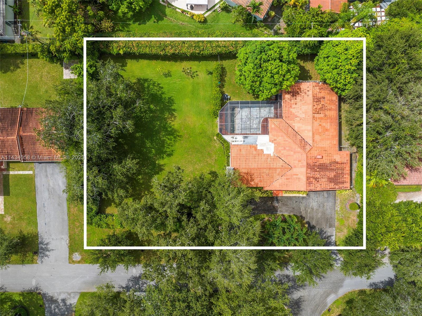 Rare double lot on Catalonia Avenue, in Coral Gables. Great opportunity to build your dream home, or remodel. Beautiful 17,604 SF double lot, with oak trees, and lush landscaping. The property is situated on a lovely quiet street in one of the most prestigious residential, and historical areas, of Coral Gables. The existing 4 bed/3 bath residence features a charming living room with original Florida pine wood paneling, cathedral ceiling, glass sliding doors with pine moldings, and original terrazzo flooring. Steps to The Biltmore Hotel and Golf Club, Coral Gables Golf Course and Miracle Mile.