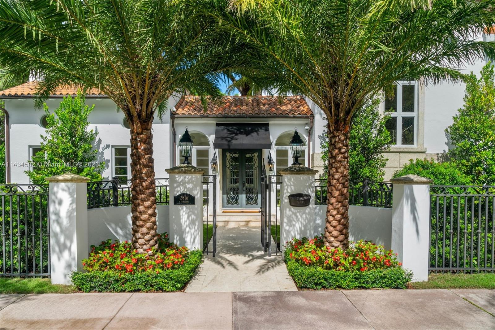 Beautiful 7,060 SF home on much sought-after North Greenway Drive in the heart of Coral Gables, with 6 bedrooms, 6.5 bathrooms, high-end design, and custom finishes. Interior features include 10' vaulted ceilings, arched doorways, and impact French doors and windows, providing ample natural light and outdoor views. A true chef’s kitchen features Wolf/SubZero appliances and a breakfast area with bay windows and views of the pool and garden. The sizable 17,355 SF gated lot offers several outdoor areas ideal for entertaining, with covered terraces, two gourmet summer kitchens, saltwater pool with jacuzzi, pergolas, and a charming courtyard with a magnificent oak tree. Other features include a Loxone smart home system, indoor/outdoor audio system, Visual Comfort lighting system, and more.