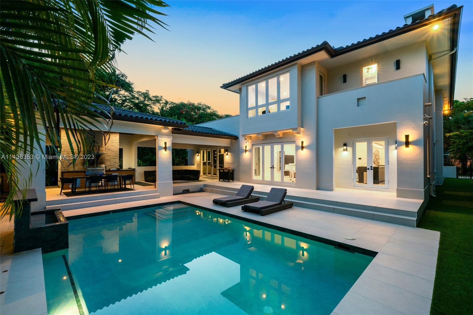 Luxurious transitional-style 4,028 sqft home. This magnificent Coral Gables two-story residence boasts 6 bed, 7 baths, and a two-car garage. With meticulous design and top-tier finishes, the gourmet Chef's kitchen features state-of-the-art appliances. The spacious living room, formal dining area, and open bar-style room offer versatility for gatherings. Enjoy integrated sound and modern conveniences with the Control 4 automation system and security setup. Step outside to a summer kitchen, inviting heated pool, and lush grounds, seamlessly blending modern elegance with comfort. Nestled in the heart of Coral Gables, just a stroll away from the picturesque Biltmore Hotel and Golf Course. Your ideal lifestyle awaits!