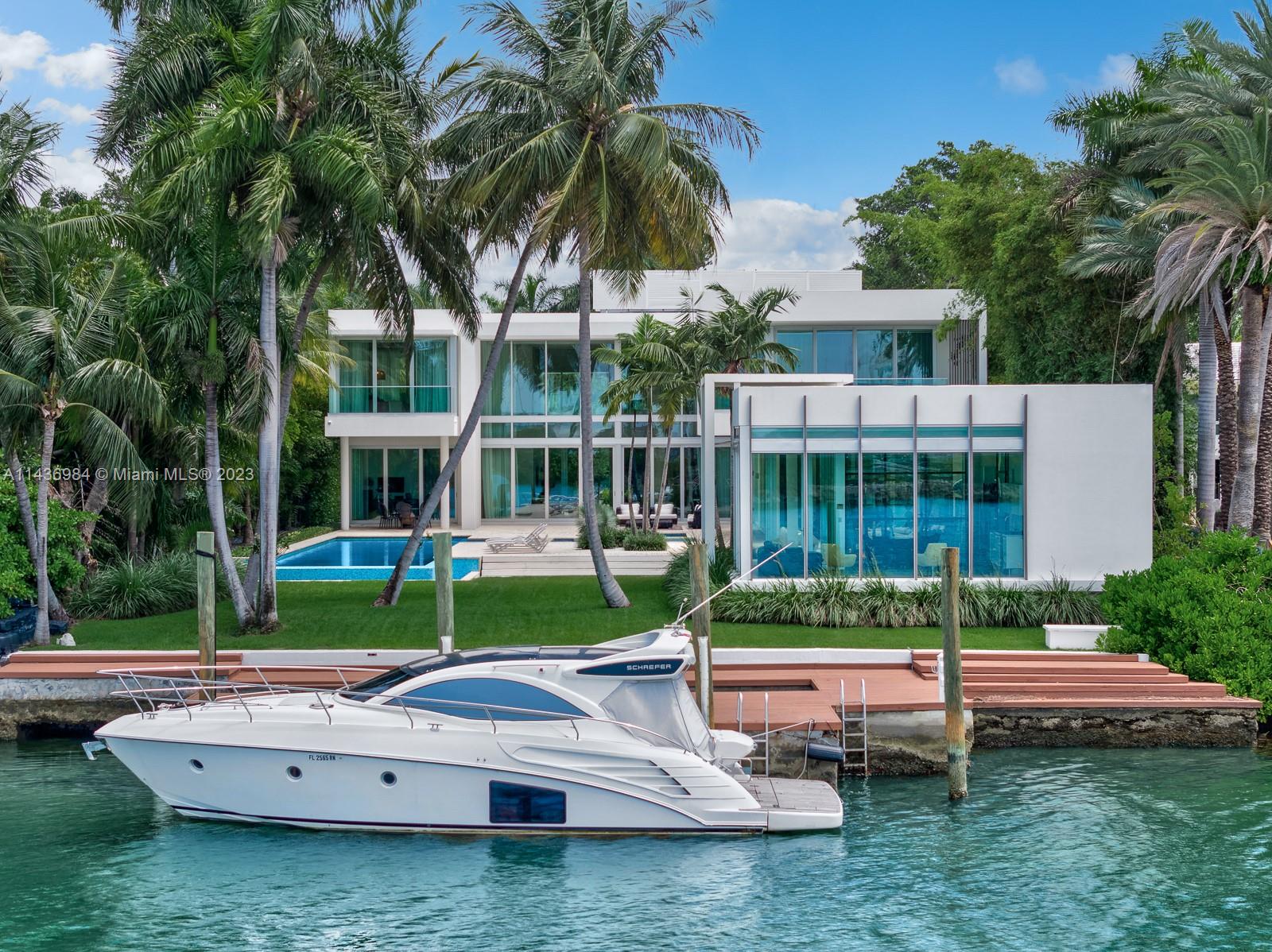 In a league of its own, this modern estate redefines luxury living on guard gated Palm Island. Nestled on an expansive 32,000 SF lot, enjoy 9 beds 8/1 baths perfectly set on 13,144 SF of total area. The chef’s kitchen is an epicurean delight w top of the line appliances, water views and walk in refrigerator. The expansive primary suite features private balcony, oversized closets, marble bathroom and private balcony. Entertaining is elevated to an art form with numerous outdoor areas thoughtfully integrated into the estate's design all with bay and skyline views. Highlights include wine cellar, movie theater, gym, staff area with dual rooms, pet room and elevator. Private dock, 100 feet of water frontage and direct ocean access complete this masterpiece. When only the best will do.