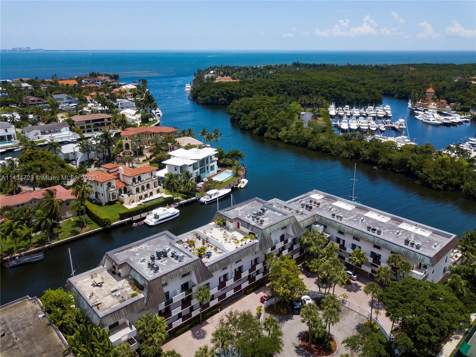 A hidden gem awaits at the crossroads where Coral Gables, Coconut Grove, and Biscayne Bay intersect. This remodeled three-story unit in the understated Gables Harbour provides waterfront living, making sunrise greetings a possibility from your balconies or your private rooftop terrace. Rooftop terrace is a unique feature with plenty of room to gather, dine, & enjoy morning coffee or evening cocktails alike! For boating enthusiasts, the allure continues with a 40’ boat-slip, offering direct access to the azure waters of Biscayne Bay—no bridges!  The unit features plenty of storage, formal & informal living spaces, updated bathrooms, spacious laundry room, & hurricane protection. Gated security, waterfront pool, covered parking space, & an enviable location make this a Very Special Home.