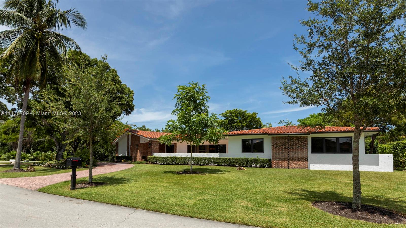 Best priced home in gated community of Gables by the Sea. Beautiful oversized corner lot with a preserved greenspace across the street. This home has a split floor plan and has two large areas that are perfect for entertaining. Spectacular features include: two expansive courtyards, brick columns, and large windows, providing natural light. Located near several top schools in Miami! Walking distance to Bay & Lugo Point.