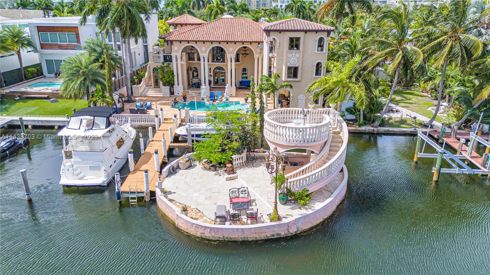 One of a kind Mediterranean Oasis in the heart of Sunny Isles Beach. Custom built and expanded on by its current owner, Civil Engineer and Founding Father of Sunny Isles. Truly stunning waterfront estate situated on one of the largest parcel available in Sunny Isles Beach. Step off your boat onto your own private island or take a stroll to the neighborhoods private beach access. Featuring three separate independent dwellings, this estate offers accommodations for family, friends, and staff. 8420 Sq ft under air featuring 9 bedrooms, 5 of which with on suite accommodations, 8 full bathrooms, 2 half baths, 4 kitchens (3 indoor, 1 outdoor), and more! 1/1 Guest House, 2/2 + Den in law suite, and 6 bedrooms in the main. Property extends 65 feet beyond the sea wall providing additional dockage.