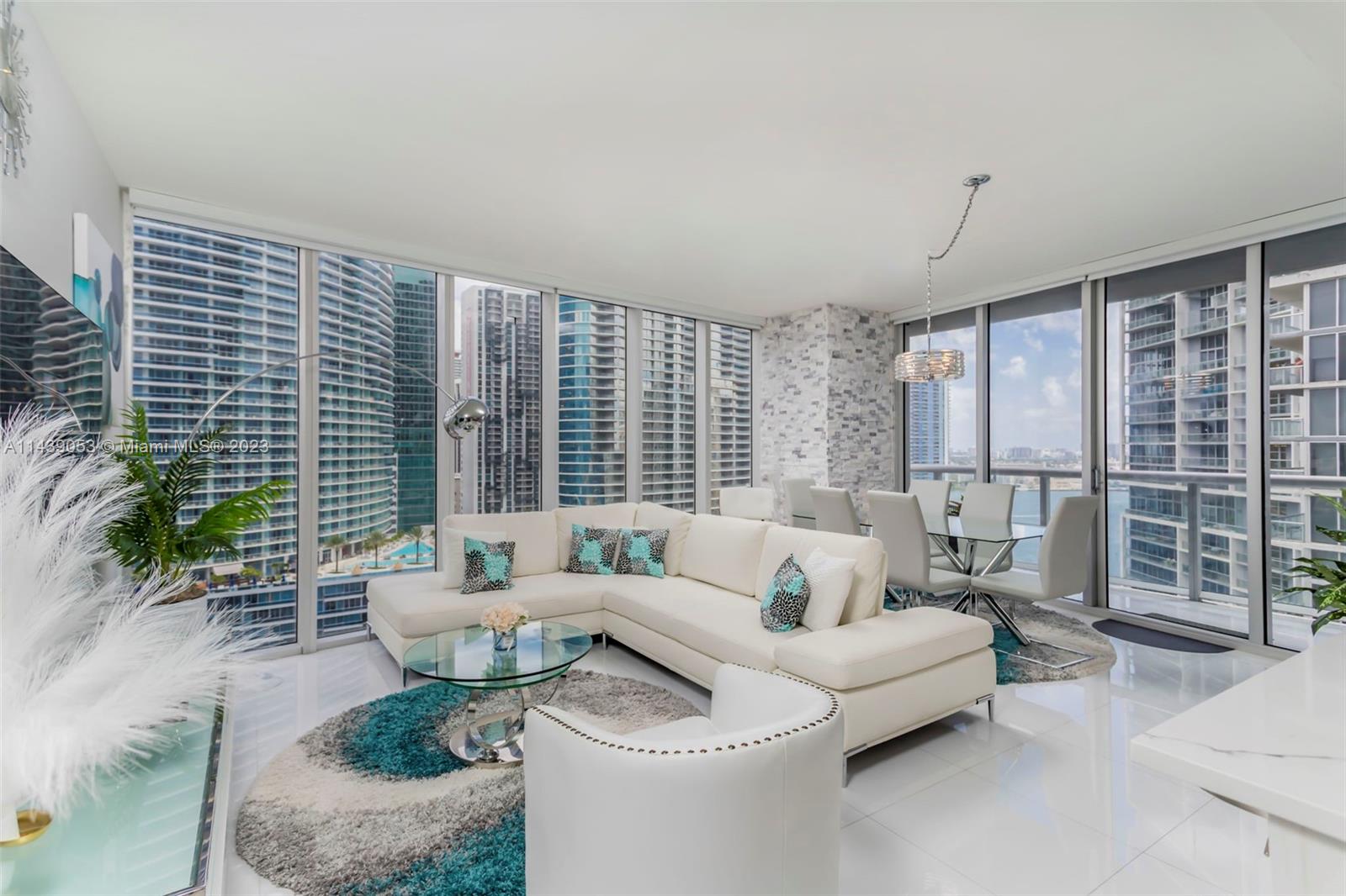 Very rarely listed, beautiful 02 Line "Corner Unit" directly on the Miami River with unobstructed views of Biscayne Bay all the way to the Atlantic Ocean, and overlooking the Rooftop Pool.  Newly renovated, Contemporary Kitchen with Stone Wall Accents that flows directly into the Living Room which is surrounded by Floor-to-Ceiling Windows.  Water Views from every room.  Two private Waterfront Balconies.  Short-Term Rentals Permitted, with the freedom to self-manage if you prefer.  Amenities include the 300,000 gallon Rooftop Pool on the Bay, 5-star spa, waterfront gym, and on-site dining (including Cipriani). Walking distance to the best shopping, dining, and nightlife in Brickell, including the Brickell City Center. 15 min from Miami Beach and Miami INTL. Airport.