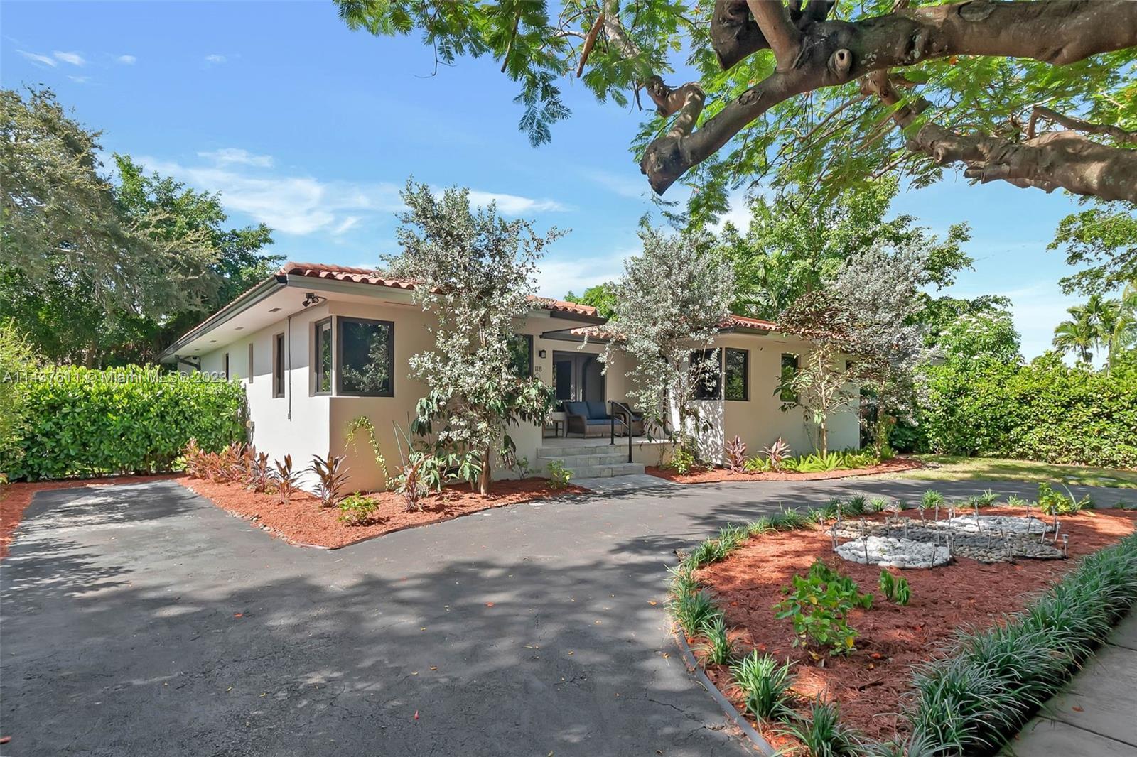 Exquisitely renovated Coral Gables home, perfectly situated for walkability. This 2274 ft. turnkey residence boasts 4 generous sized bedrooms (2 primary suites, and all with large closets) + 3 full baths. The living space is graced by soaring vaulted ceilings accented with exposed wood beams, and the dream chef's kitchen caters to culinary enthusiasts. The outside features an expansive, fully turfed backyard with covered patio & room for pool, as well as a versatile side yard. A circular driveway complete with EV charging station provides ample parking. Recent updates include impact windows & doors, new plumbing & electrical, HVAC, and much more. Positioned on a tranquil street, this home is walking distance of Miracle Mile, Merrick Park, The Biltmore, Coral Gables Youth Center & Library.