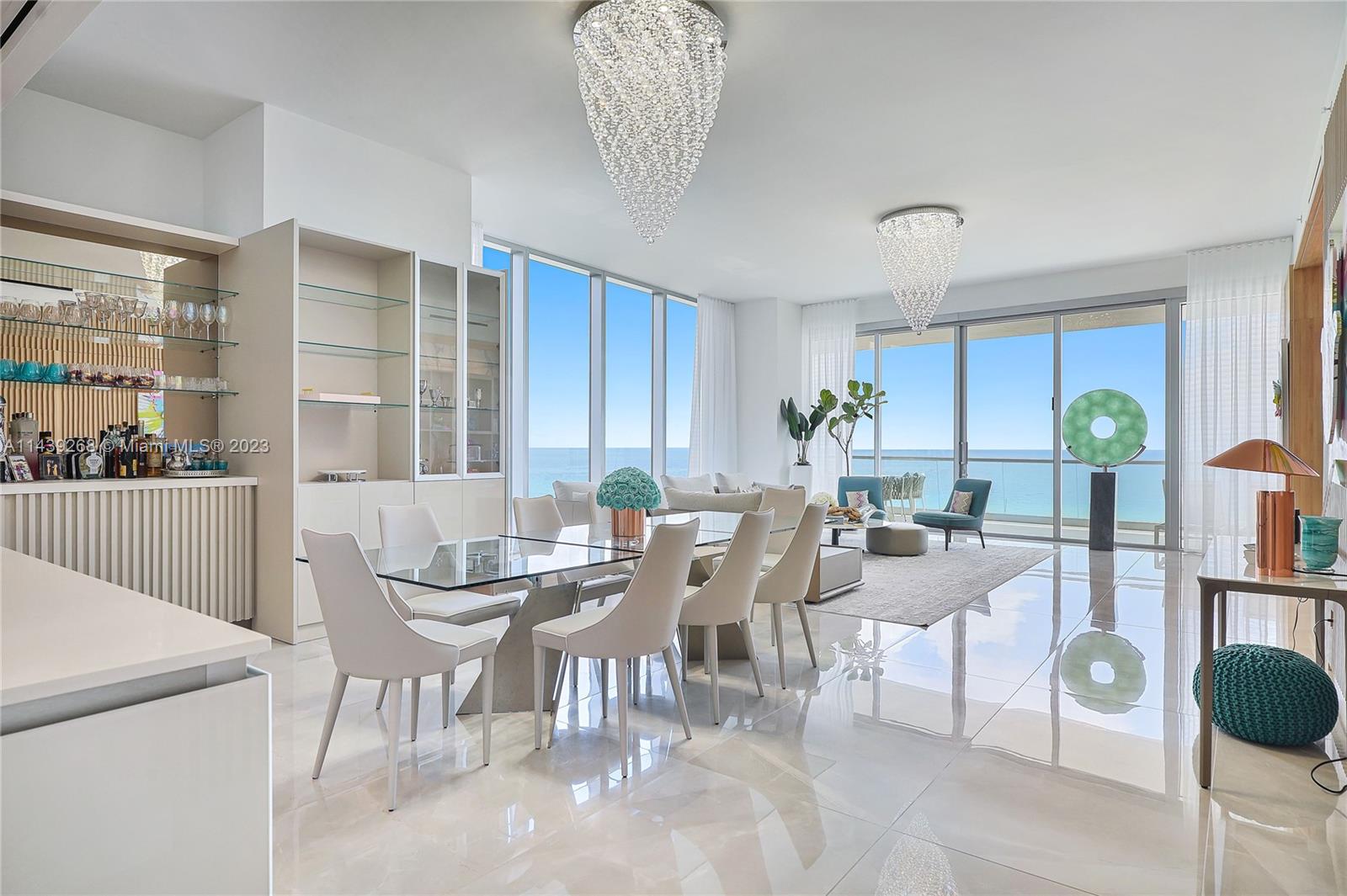 Unit 501 at Turnberry Ocean Club offers the Miami Resort lifestyle you've always dreamed of. This masterpiece features custom interiors, an Italian-imported chef's dream kitchen, and expansive ocean views. As you step into your private elevator foyer, you'll be greeted by spacious living areas, top-of-the-line Gaggenau appliances, and custom cabinetry. This floor-through apartment provides breathtaking direct ocean views from the living room, dining area, and master bedroom, while the three additional bedrooms and maid's quarters offer captivating views of the Intracoastal waterway and the city.