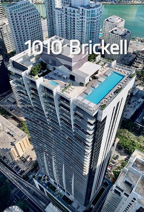 The 1010 Brickell building boasts an impressive array of amenities. Residents can enjoy a movie theater, a restaurant and a breathtaking swimming pool on the 50th-floor rooftop. The spa, complete with a jacuzzi, massage and treatment rooms, sauna, and steam room, offers a haven of relaxation. For the active-minded, basketball, mini-soccer, and racquetball courts are available. Families will love the kids' indoor playground, include a modern fitness center, party room, and an arcade packed with bowling and virtual golf. Located at the vibrant heart of Brickell, it's a short walk to the Metro-mover and the Brickell City Center. This luxurious condominium offers 3BR+3BA+ DEN, all under 9-ft high ceilings. A private elevator, porcelain flooring the unit complemented by custom closets and doors