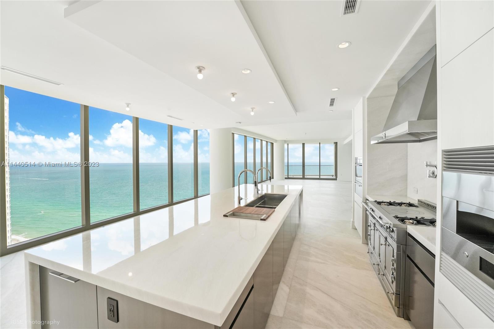 Stunning custom designed 4-bedroom, 4,5-bath residence at The New Estates at Acqualina North Tower.  This elegant home boasts a sweeping panoramic ocean and skyline views. The combination of white wash oak wood and mystery white marble floors, onyx fireplace, adding elegance and charm to every room. A state-of-the-art Creston smart home system, gourmet kitchen by Dada Engineered with La Cornue gas range, pizza oven and 14 foot long onyx island, summer kitchen and sauna at the terrace, making this move-in-ready unit the ideal beachfront residence. The primary suite is a true sanctuary with ocean views and midnight bar, Molteni&C leather-covered walk-in closet and a luxurious spa-like marble bathroom.  Every detail has been carefully curated to meet the highest standards of luxury living.