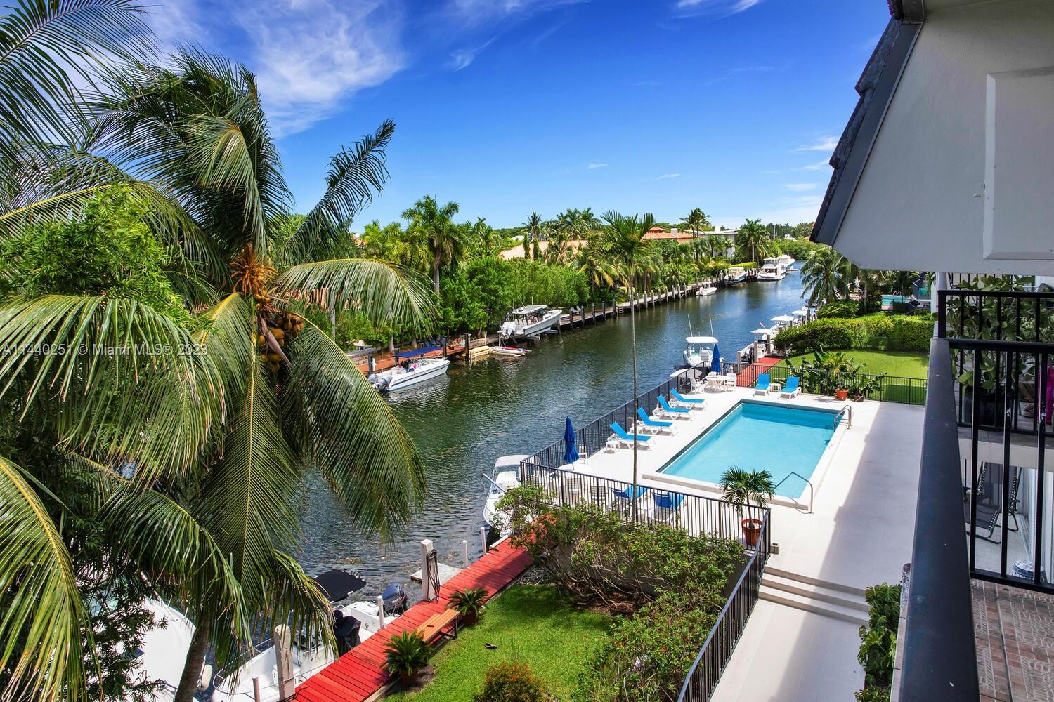 Rarely available Coral Gables waterfront property with breathtaking panoramic views of the canal. The top floor corner location of this unit ensures privacy and a tranquil atmosphere. Nestled in a boutique building along the coveted Edgewater Drive. Wood floors throughout create a timeless charm, while abundant natural light fills every corner. The highlight of this 2 bd/2 ba residence is undoubtedly the unobstructed canal view and the best part – no bridges stand between you and the bay. Your own covered assigned parking space ensures convenience and protection for your vehicle. Convenient in unit laundry and 2 yr old A/C, impact windows and doors.