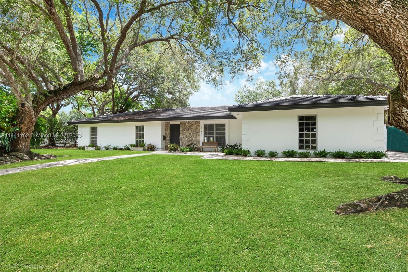 Begin a new chapter at this wonderful 5-bedroom home fabulously located within walking distance to the infamous Coral Reef Park and Coral Reef Elementary School. Nestled in a park-like setting under a canopy of Oak trees, this stand-out corner residence will please the most discerning buyer w/ its enormous social spaces for entertaining, formal dining room, eat-in kitchen w/ island, and fantastic pool and garden views from nearly every corner. Other outstanding features include a divine master suite with adjoining office/sitting room, 4 additional guest bedrooms, laundry room, French patterned stone floors, two-car garage, new roof, and the most glorious alfresco setting w/ phenomenal pool and covered terrace! Don’t miss this treasure; the home, property, and neighborhood are exceptional!