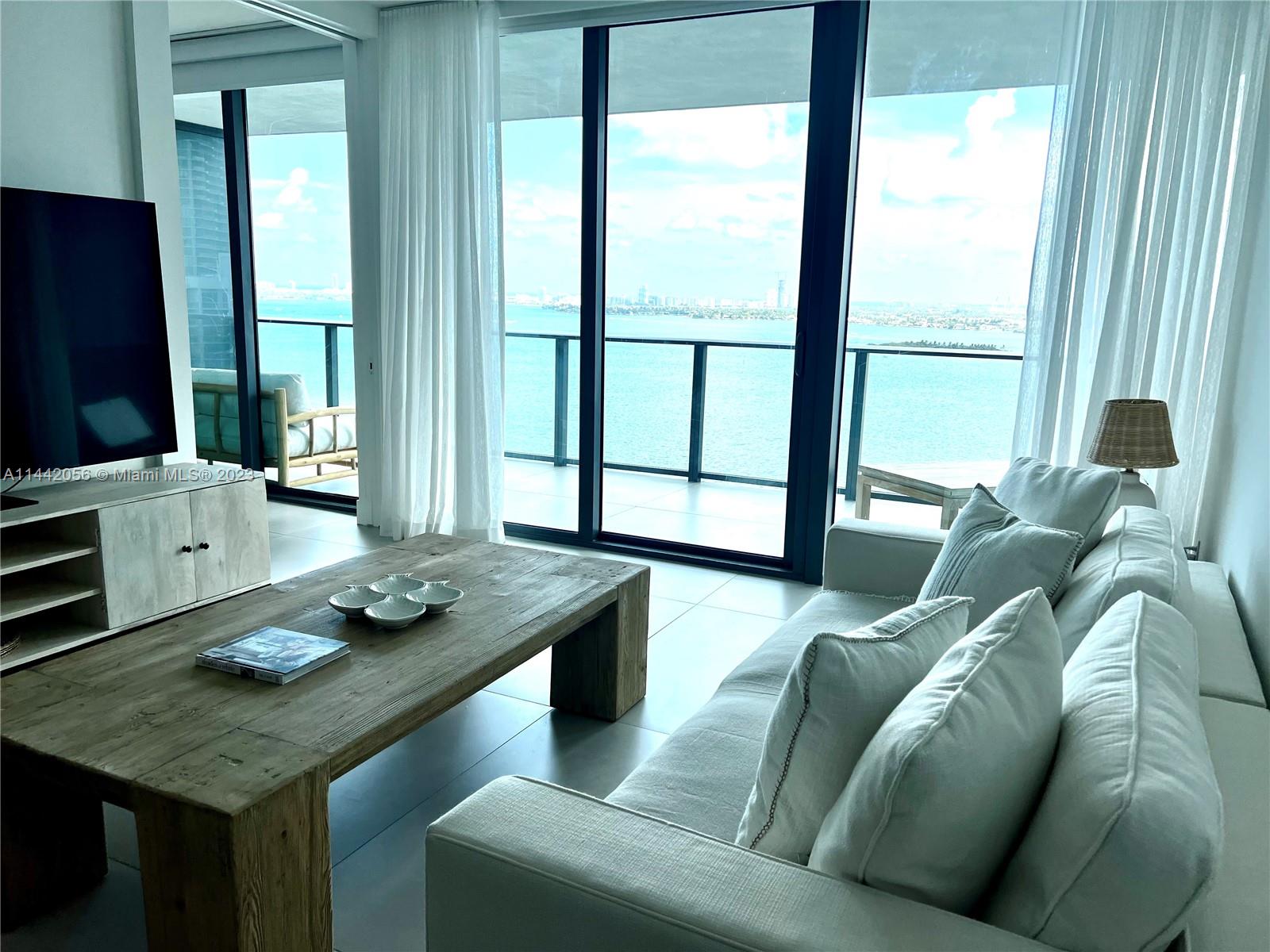 Spectacular, fully furnished unit at waterfront luxurious Paraiso Bay. Enjoy amazing direct bay views from this immaculate apartment. This elegant residence features a private foyer with a gorgeous 2 Beds + Den with office space and 2 Baths with porcelain floors, open kitchen with Subzero and Wolf appliances, custom closets in both Bedrooms. Indulge in resort-style amenities that elevate your living experience to new heights. fabulous oasis-style 3-acre pool-deck, theater, spa, wine cellar, playground, tennis, bowling, hi-tech fitness center, yoga studio, indoor/outdoor lounges, teen+kid arcade & so much more!
Also available short term (3 months minimum).