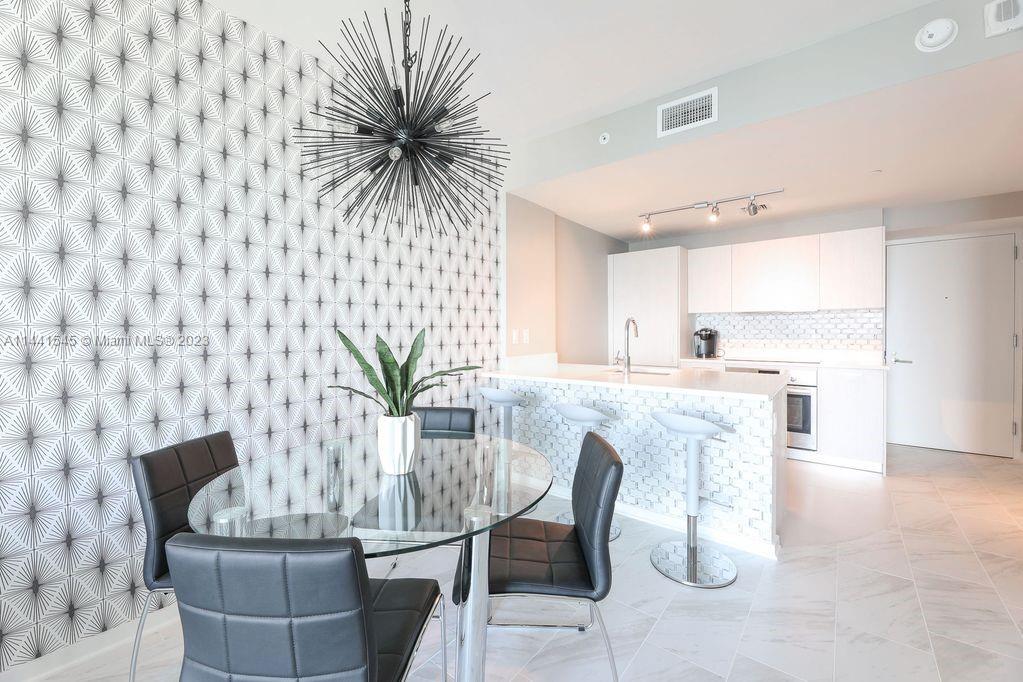 SEASONAL RENTAL!!! MIN 30 DAYS MAX 6 MONTHS. Enjoy amazing sunsets from your balcony. Incredible amenities including a Heated Rooftop Pool with 360º views of Miami. Building offers 2 heated pools, hot tub, 4 BBQ grills, tennis court, gym, sauna, spa, games room, party room, co-work area, and kids room. title floors, built in closets, and windows treatments. Call for Rates