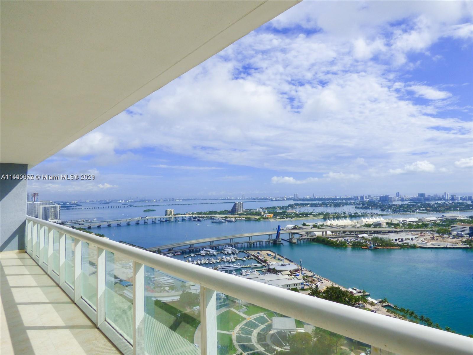 Gorgeous water and city views from every room overlooking Bayfront Park and complete wrap around balcony. Large and spacious bedrooms with black out shades and en-suite bathrooms as well as custom closets. The master bedroom has his/hers closet as well as a jacuzzi bathtub. Kitchen comes equipped with Bosch appliances and custom backsplash. Large capacity washer/dryer. Magnificent 3 story lobby, Building amenities include 24 hour Concierge, security services, and Valet parking. With infinity Pool Cabanas, snack bar, and Gym. Located just minutes from Brickell, Midtown, South Beach and Airport.