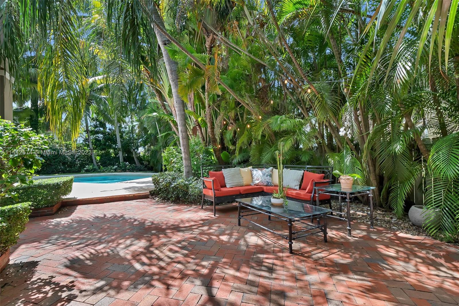 Gorgeous 5 bdrm/ 3 bath tropical-style residence in gated community of Old Cutler Cove in N Palmetto Bay. Formal living rm w/ volume ceilings, large formal dining & stunning Mexican Saltillo floors. Fantastic kitchen w/ granite counters, wood cabinets, stainless appliances, snack bar, breakfast area, pantry. Spacious family rm w/ built-in bookcases, full bath & 1 bdrm/den on the 1st level. Upstairs are 3 more bedrooms plus primary suite w/ balcony, walk-in closet, marble bath w/ double sinks, separate shower, whirlpool tub. Spectacular lush garden, private grounds, large pool, paver patio w/ BBQ ideal for entertaining. Brick paved driveway, 2-car garage. New metal roof. Wonderful location, near 50-acre Coral Reef Park w/ tennis/pickleball cts, playground & walking path.
