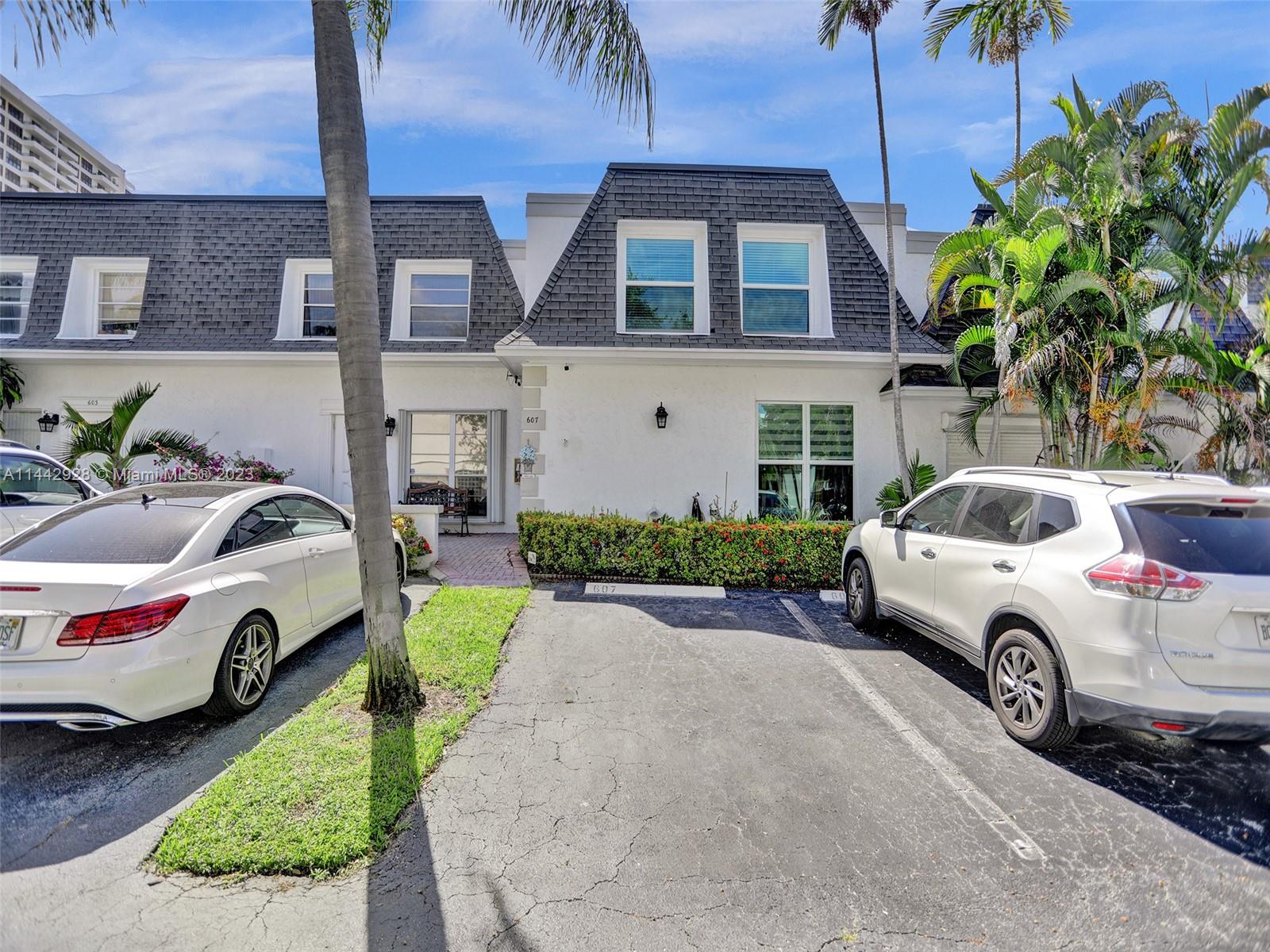 Amazing opportunity to own in east Hallandale Beach on intercoastal water. Townhouse is large J unit. Ready to move in. Near shopping, worship, Hollywood broadwalk, beaches and nightlife. Open floor-plan w/living room/dining room combo spacious eat-in kitchen. Private tiled backyard overlooks your own dock & boat lift. Second floor large master bedroom w/screened in balcony. 2021 new awning. Master bedroom has remote motorized blinds installed 2020. Laundry room 1 yr old LG W/D - 1 yr extended warranty left. 2019 Impact windows & doors. 2021 tankless water heater. 2022 new a/c with 1 yr transferable svc warranty just updated. SOLD AS IS! MOST FURNITURE IS INCLUDED IN PRICE - WALL-ART IS EXCLUDED FROM SALE!!   ASSOCIATION HAS LARGE RESERVES
