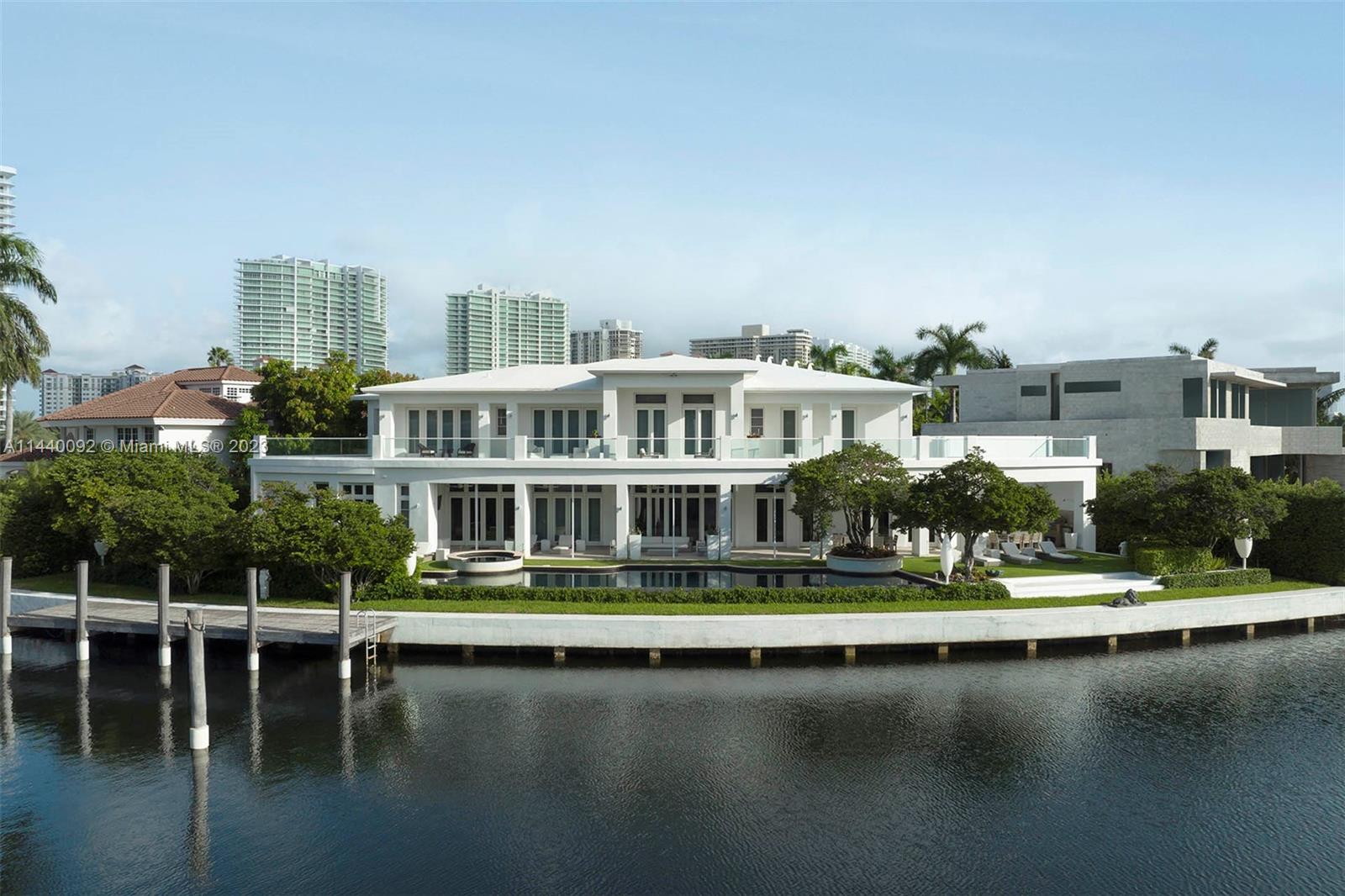 Nestled in the heart of the exclusive Golden Beach community, 142 S. Island Drive encompasses 0.41 acres+/- of waterfront land with manicured exteriors, a private dock, and an expansive modern home.
This residence boasts sweeping Intracoastal vistas and 11,337 SF+/- of living space with 6 bedrooms, 8 full and 1 half bathrooms, representing an incredible opportunity to take in the exquisite atmosphere of Golden Beach or set off via boat to visit the community’s private shore and nearby cultural centers.