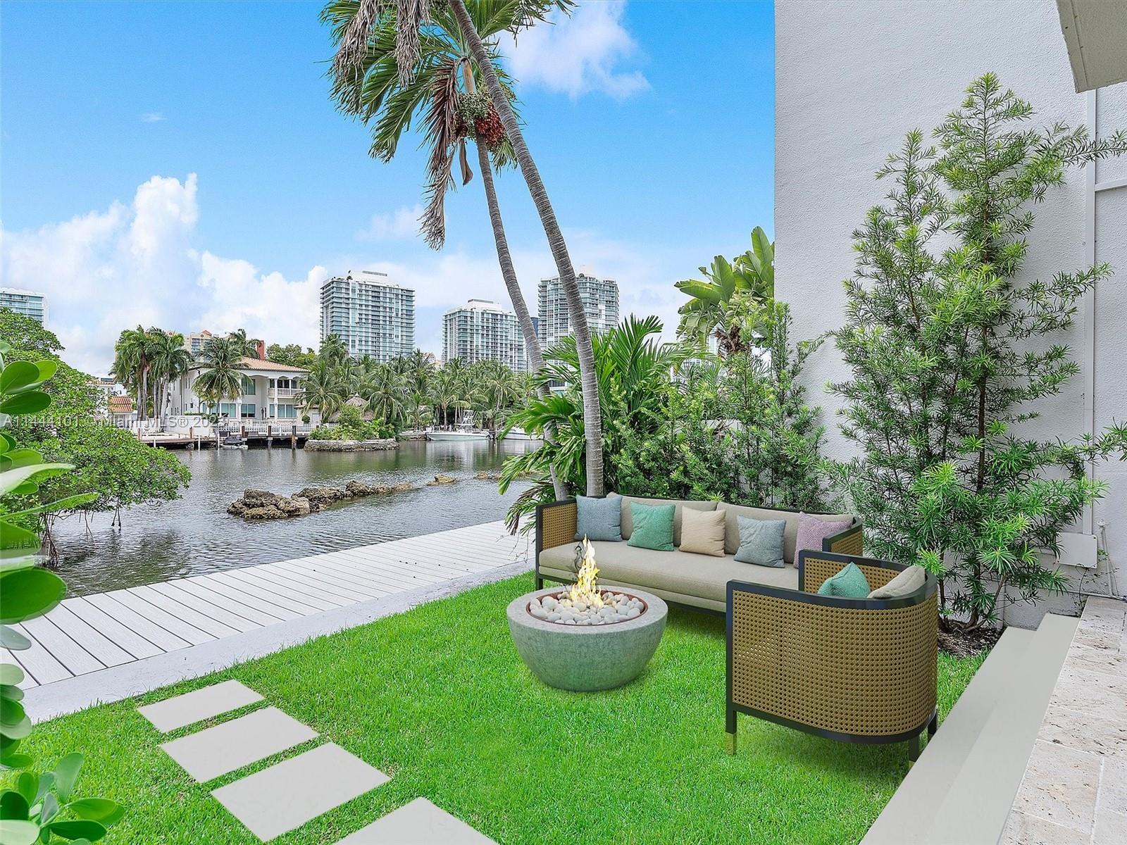 *MOVE IN READY* Welcome Home to Poinciana Island Yacht & Racquet Club. This hidden gem is located across the street from the Beach in Sunny Isles. Immerse yourself in the delights of this updated townhouse residence on the waterfront, featuring an open floor plan. The first floor consists of a renovated kitchen adorned with elegant white gloss cabinets, stainless steel appliances, and exquisite quartz countertops. The living room boasts luxurious 32 x 32 porcelain tile floors, high-impact doors and windows, along with a guest bathroom and bedroom which opens up to a private patio. Bonus, a new boardwalk has just been completed for your enjoyment.

A Boaters paradise, option to build a private dock. Amenities include: tennis courts, 2 pools, gym, racquetball, and basketball courts.