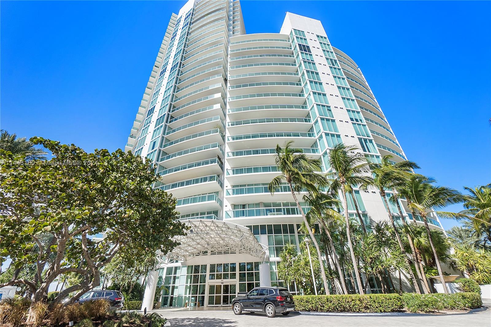Experience one-of-a-kind indulgence in this rare corner unit showcasing dramatic views of Biscayne Bay, Fisher Island, South Beach, and the glittering Miami cityscape. The sleek interior radiates modern elegance with custom details like built-ins and a chef's kitchen appointed with premium appliances. Entertain effortlessly on the sprawling 14-foot-deep balcony, directly accessible from the light-filled living room. Retreat to the spa-like main bathroom off the iconic primary bedroom. The two spacious terraces overlook both city and sea. Enjoy exclusive amenities like a private beach club. Beyond your private oasis, some of the world's best dining, beaches and marinas are just minutes away. This is luxury, convenience, and beauty combined in a truly matchless way.