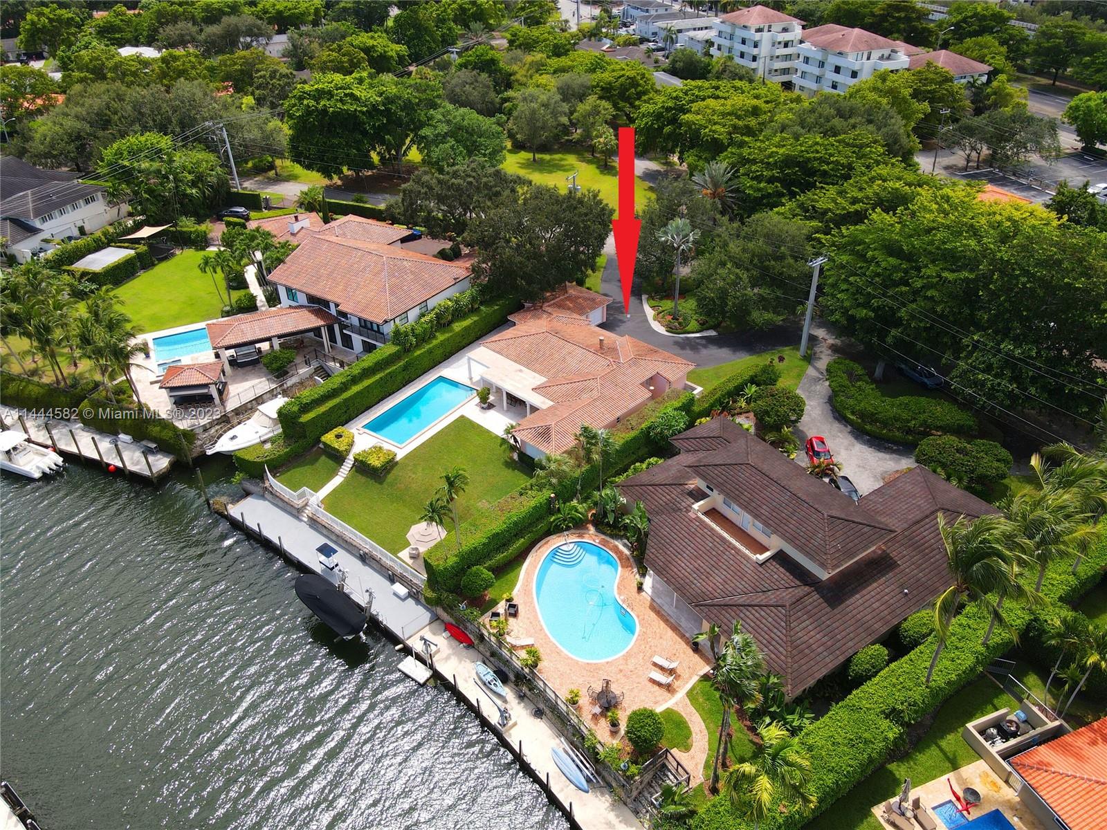 Welcome to this 4 BR, 4 BA boater’s dream home prominently situated on the Coral Gables waterway. This gracious property features 75 ft of water frontage, private dock & boat lift, providing seamless navigation under two high bridges to the open water. Step inside the 2,646 sf house & discover a classic floor plan with split bedrooms, eat-in kitchen & spacious living spaces that open to the outside through sets of French doors. Outdoor living is further enhanced with a 20x40 foot pool, a deep covered patio and a sprawling lawn on a 15,300 sf lot which is elevated high above the canal. Enjoy living in an ideal location w/ easy access to the vibrant amenities of South Miami, the cultural offerings of the University of Miami, & prime water access & views!