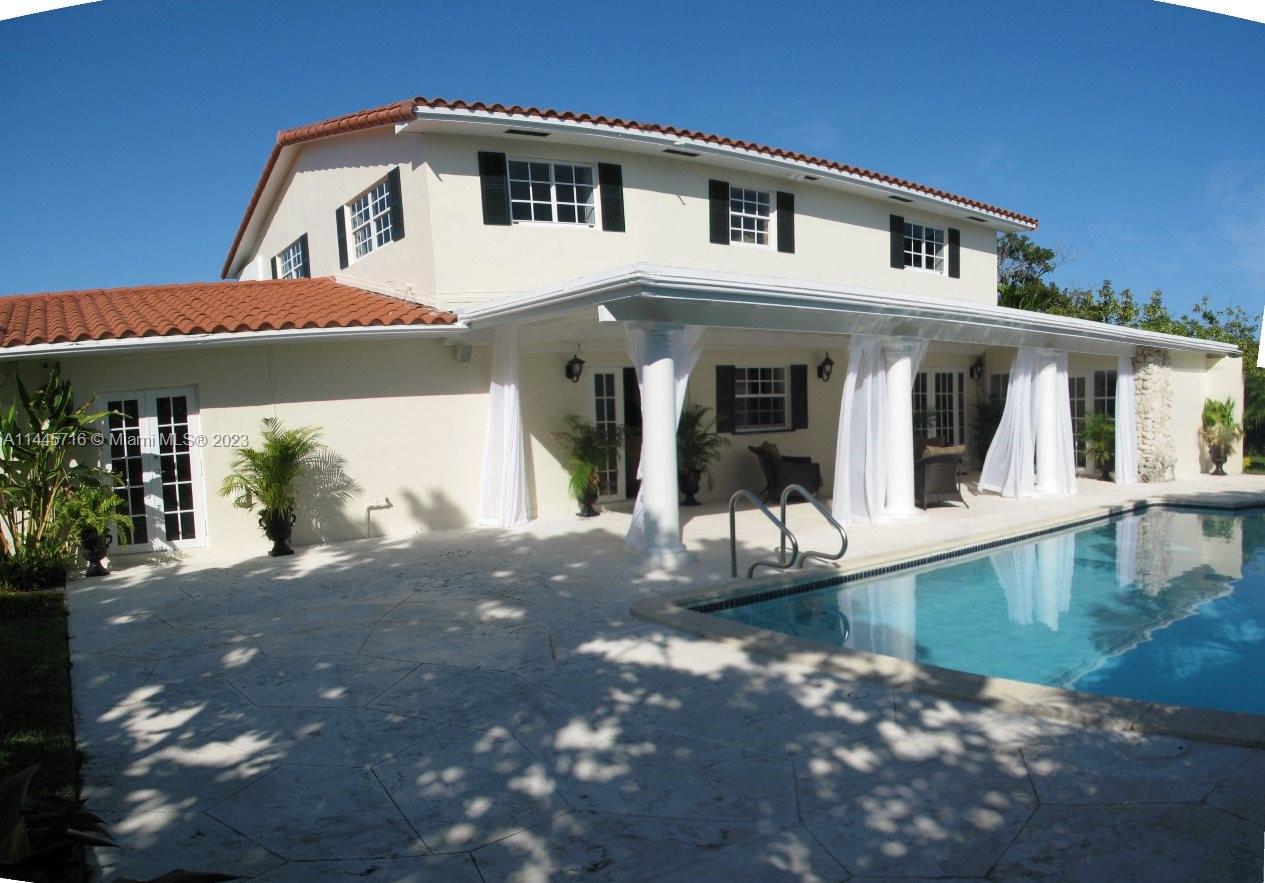 Beautiful Remodeled Home + pool + canal in Pinecrest. Located east of US 1 with top ranked schools, shops, parks and restaurants within short distance. On a quiet cul-de-sac.
Two-story level residence 4 bedrooms, 5 walk-in-closets, 4 baths, one is a cabana bath, 2 family rooms and 2 car garage. Granite and wood floors, double laundry, louvered shutters, double kitchen oven, large lot.
Two suites on opposite ends of the house. Master bedroom with two walk-in-closets, master tub, bidet and separate frameless glass shower. 
Modern style Wood and granite eat in island kitchen with stainless steel appliances overlooking spectacular covered terrace, backyard, pool, and canal waterway. French doors leading to the patio and pool area. Tropical landscaping & mature mango and avocado trees.
