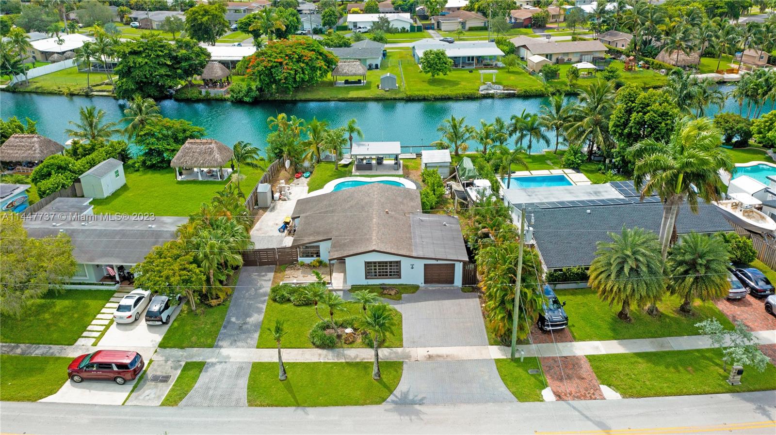 Looking for a paradise to call home? You will love all that this home has to offer! Bring the boat, the RV, the golf cart, there's parking for all the toys. You will love the breathtaking canal views, complemented by a chic entertainment cabana perfect for gathering friends & family. Relax in the brand-new pool & adjacent hot tub, or invite the crowd over to watch the game! The boat ramp makes enjoying the canal a breeze! Jet ski, boating, kayak, paddle board & fishing all from your back yard. Inside, modern updates & bright spaces. The converted garage adds another room & bathroom for guests. Located on the north end of Cutler Bay, in a prime location. You'll be in the center of everything you need. Schools, shops, restaurants, expressways, groceries, marina, parks, NO HOA. VIRTUAL TOUR!