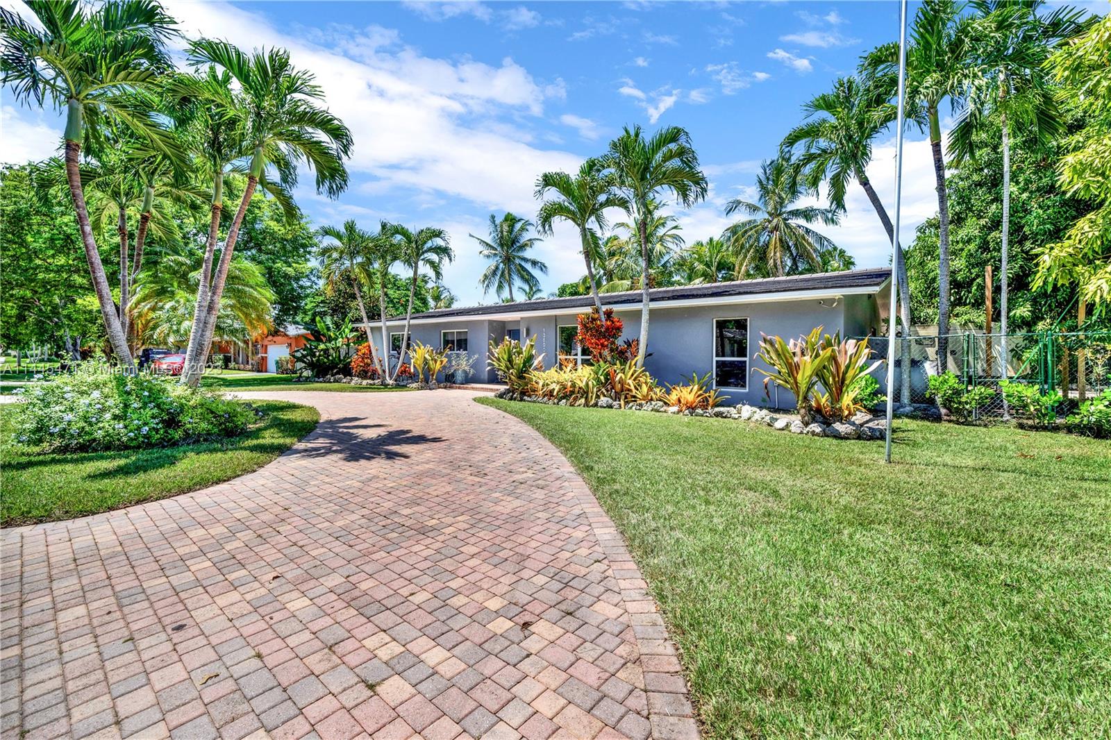Rarely Available Palmetto Bay 5/3 on a corner lot. Updated & lovingly maintained this is the move-in-ready, spacious family home you’ve been looking for! Enter a large split bedroom, open concept living,family, and dining w/ glass drs bringing in light from the tropical outdoors. Porcelain tile floors throughout living areas, and wood floors in oversized bedrooms. Owner's suite is attached to an extra room perfect for a home office or gym. Updated bathrooms, 2 year old roof, whole hse generator w/ auto switch, fruit trees, and plentiful glass drs open to a jacuzzi pool/patio and built in barbecue overlooking private backyard perfect for outdoor enjoyment. Come find peace within this lovely home in sought-after neighborhood steps away from beautiful parks & top-rated public/private schools!