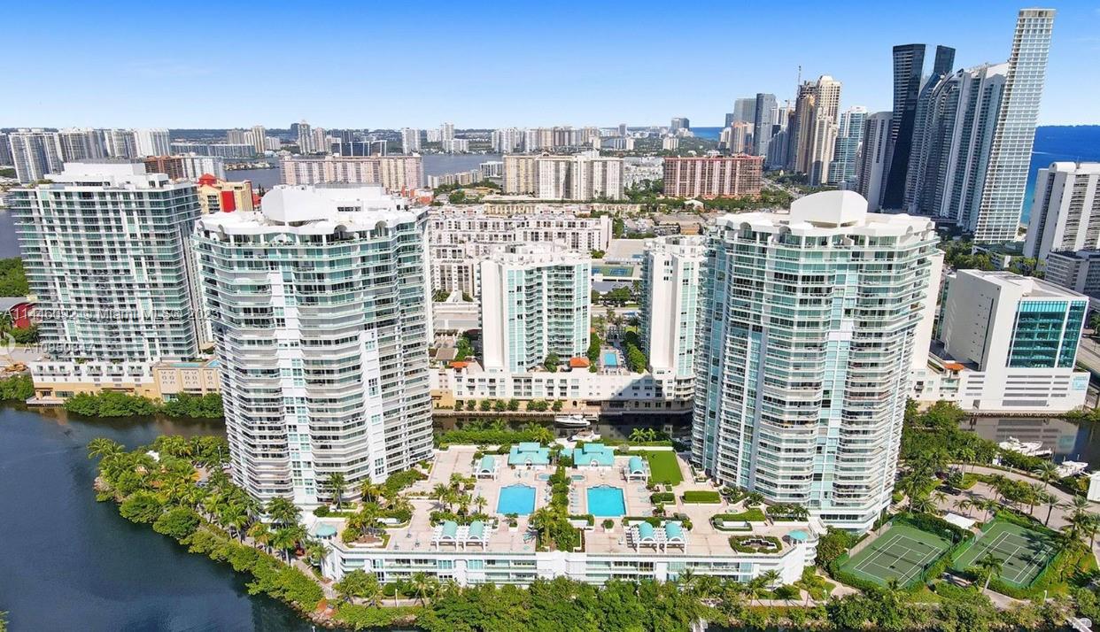 Located on an exclusive private island on Sunny Isles, with wrap around balcony and views of the marinas. This stunning and sprawling three bedroom, three bathroom, 2,340 ( 2,700 with balconies ) square foot corner apartment is luxury at its finest. Offering tennis courts, marina, and a fitness center located in the building. As well as the buildings beach club which offers beach service, two restaurants, beauty salon, spa, racquetball, basketball, and a fitness center with daily classes. This unit is what any owner would dream of.