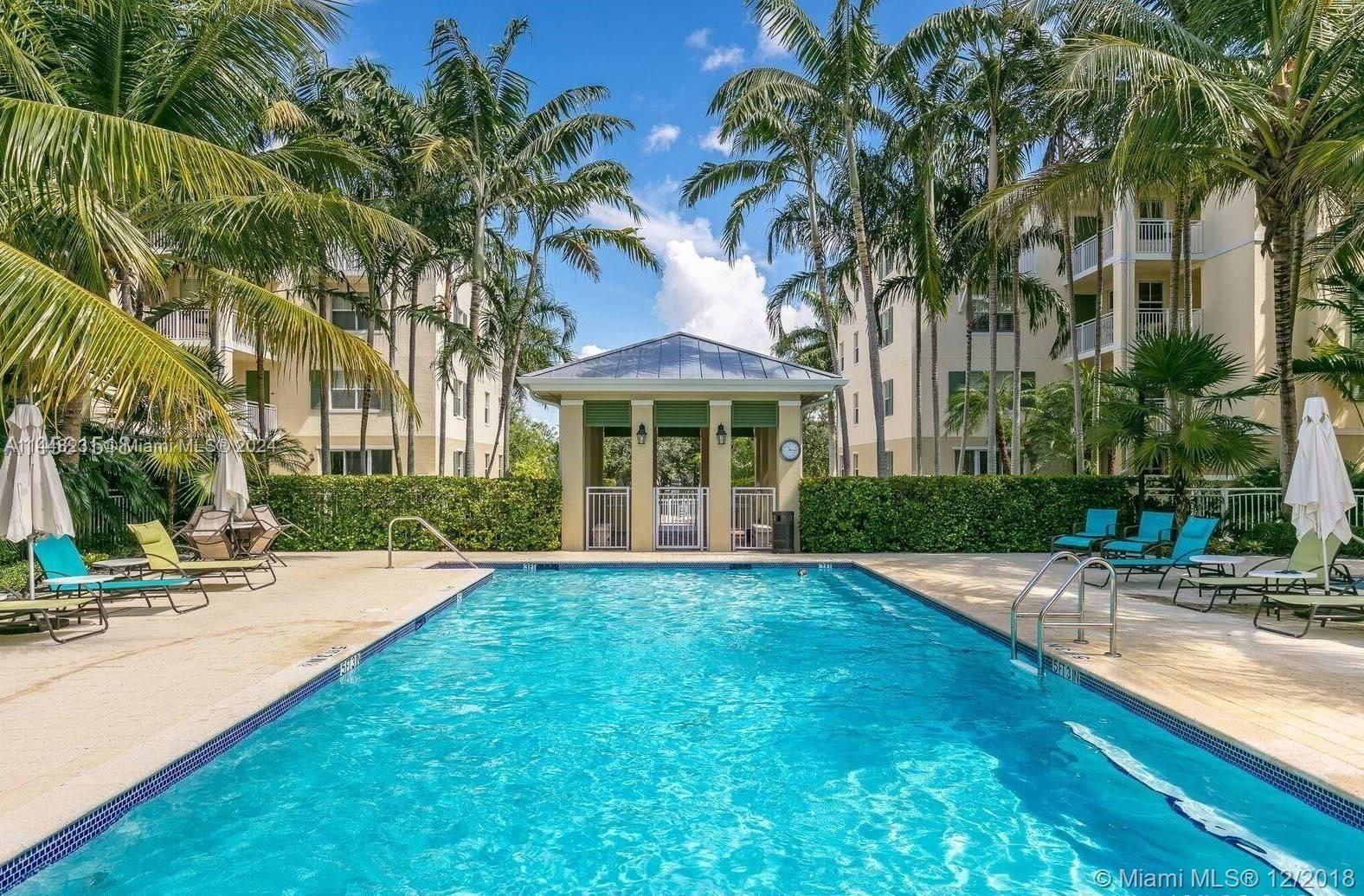 One of the very best in The Reserve of Pinecrest! Large 2-story 4/3.5 fully updated unit with fantastic layout and large common spaces. Renovated modern kitchen, gorgeous wood and marble floors, updated baths, impact glass and much more. Laundry room, large balcony, glassed-in stairway! Prime quiet location within the complex- facing the park in back with lush view from balcony. 2 parking spaces located near elevator. All of the best Pinecrest schools!