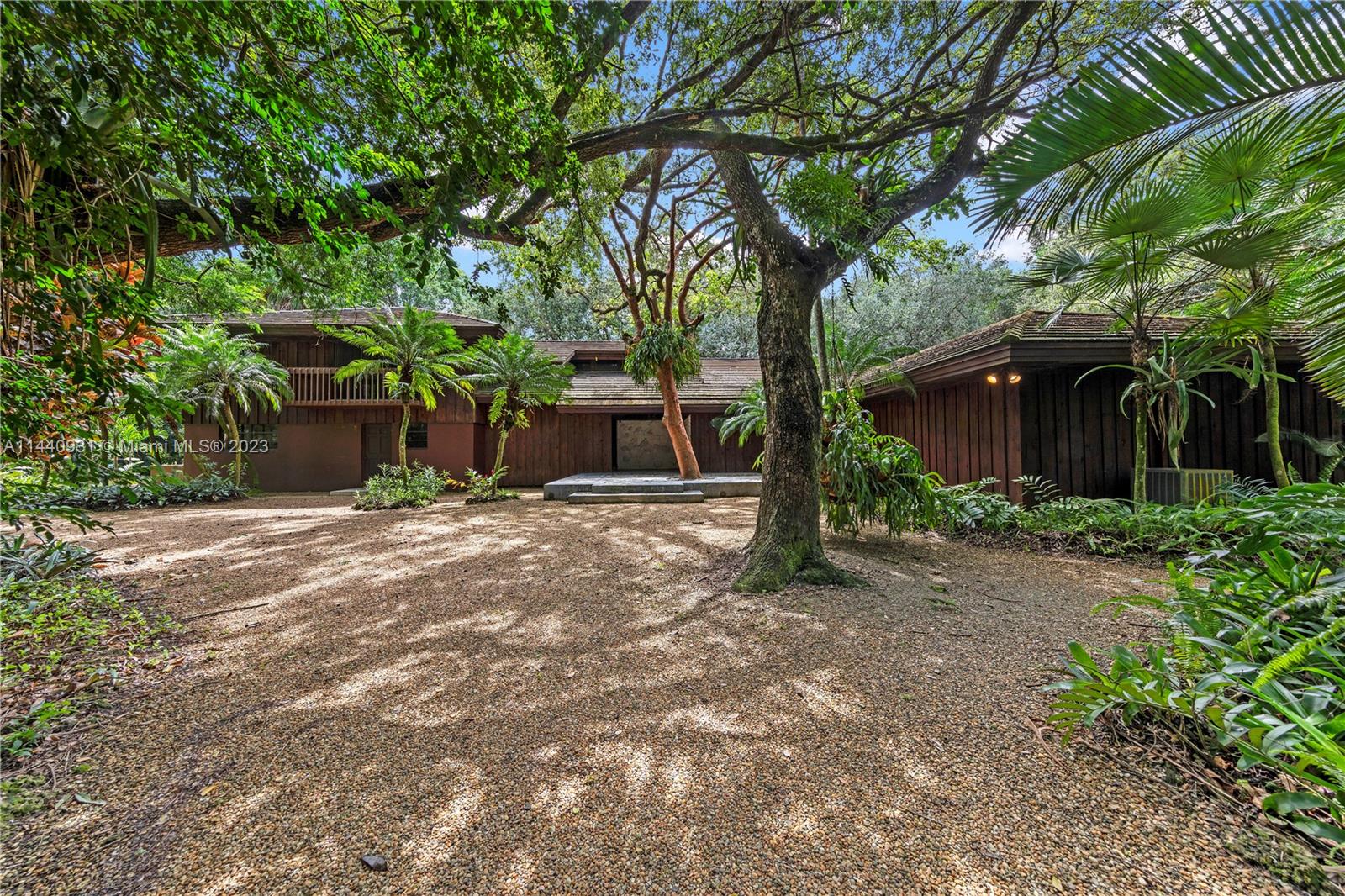 IF YOU ARE LOOKING FOR FOREVER PRIVACY..5 ACRE ESTATE LOCATED IN MIAMI, IS A ONE OF A KIND 5 /4.5  BUILT TO BE PART OF NATURE NOT CONFLICT WITH IT. THE MINUTE YOU ENTER YOUR BODY AND MIND ADJUST TO BECOME PART OF NATURE, ONE WITH THE LAND. THIS IS AN EVENT. SHES A TASTEFULLY APPOINTED ORGANIC HOME WHICH FEATURES TRAVERTINE THRUOUT, 3 SUITES W/ A LIBRARY & SITTING IN THE UPSTAIRS MAIN. BALCONIES OVERLOOKING PARADISE. THE CHEF'S KITCHEN IS AN ENTERTAINER'S DREAM, A FULL DINING EXPERIENCE, COMMERCIAL GRADE. ALL WINDOWS AND DOORS ALLOW THE LANDSCAPE IN TO BECOME PART OF YOUR LIVING EXPERIENCE. EVERYTHING OPENS UP TO THIS NATURAL FORREST. YOU'RE LIVING INSIDE OF LIVING ART. THIS IS ALL ABOUT LOCATION AND LIFESTYLE. IDEAL FOR RETREATS/EVENTS OR HOME.