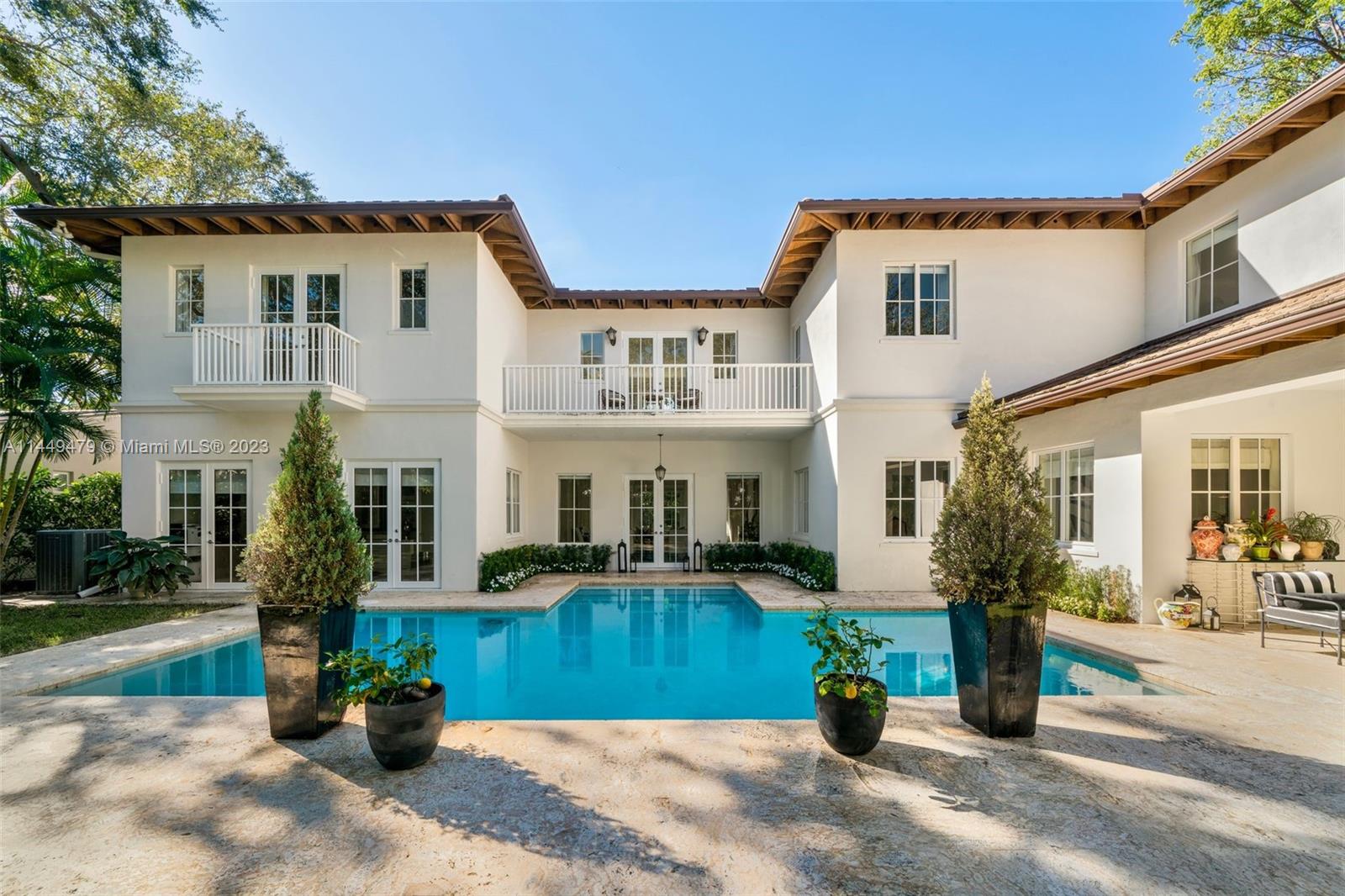 Quiet and gated 12,500 SF lot in the desirable High Pines area, this spectacular two-story, 7,259 SF 6-BD and 6.5-BA home is filled with natural light and casual elegance. Egyptian stone and wood floors carry across the spacious living and family areas, including two family rooms and an office/library. The open kitchen comes with custom Italian cabinets, gas range and wine fridge. A spacious primary bedroom suite has 1,000 SF, and all the other bedrooms have ensuite bathrooms and walk-in closets. The lushly landscaped yard compliments a serene pool surrounded by coral stone pavers and covered patios. Close to South Miami’s shops, restaurants, Merrick Park and Miracle Mile. A short Metro-Rail ride into Downtown and Coconut Grove. Near top rated public and private schools.