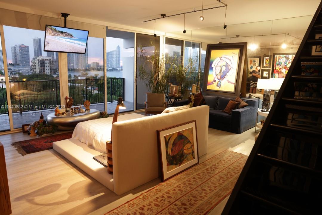 ocation Location and Million $ Views: Impeccably updated Townhome on Venetian Island. This "One of a Kind" open space has high ceilings and a second floor.Grays/Metal  plexi glass come together with a staircase to take you above: Accented with a Cement wall, Venetian plaster and Second balcony. New appliances include:AC,W/D,and Dishwasher. Building has passed it's 40 Year certification (May 2023)!! Building has also went through major renovations: recent completed projects include the North Pool repair, South Pool refinishing, New Elevators, Balcony repair and Cauking of all windows. Management/Board and on-site Engineer continually and pro-actively maintain this Luxurious Boutique piece of iconic Miami Architecture.