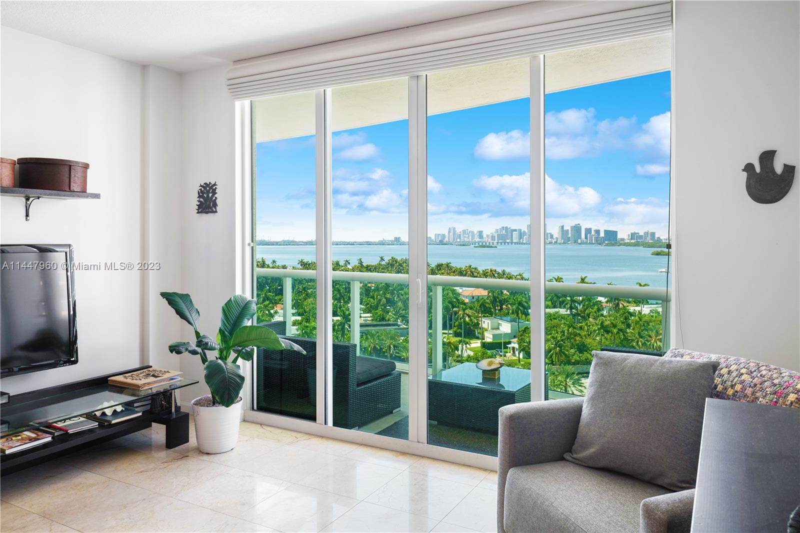 Best line in the building, rarely available. This split-plan 2-bed/2-bath residence features a modern kitchen with stainless steel appliances and granite countertops. Floor-to-ceiling windows and doors lead to a spacious balcony with breathtaking Intracoastal and Downtown skyline views while bringing natural light into the space. The master bathroom offers both a jacuzzi and shower, while marble floors grace the living room and vinyl flooring adorns the bedrooms. Located within a private, gated waterfront community, residents here enjoy access to amenities such as a private marina, gym, pool, hot tub, clubhouse, 24/7 security, free valet, and more.