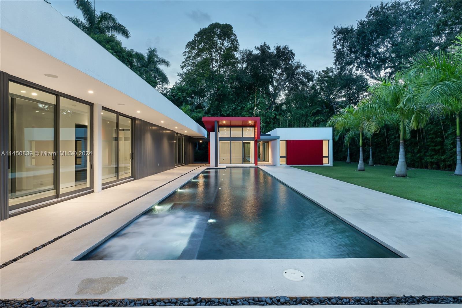 Just completed in 2022 and designed by Roney Mateu, this one story architectural masterpiece with 5265 adj. sq. ft. sits on a parklike 19,500 sq. ft. lot in North Coconut Grove. This premier estate with 11 Royal Palms is comprised of a Main house with 3 bedrooms plus gym, and 3.5 baths.  Magnificent Guest cottage has 2 rooms, plus bath, designed and wired for possible Home theater, plus guest suite.  All Entertaining rooms have 14 Ft., 8 inch ceilings. Enormous 18 X 37 Great room and sep. Fam. Room overlook the stunning 15 X 60 Ft. Lap/Spa saltwater pool through multiple sets of oversize glass doors. 2 room Master suite with 15 X 9 walk in closet. 4 car air conditioned garage with 4 Tesla Power walls, 77 solar panels, 1000 gallon underground Propane tank, all gas chef’s kit.