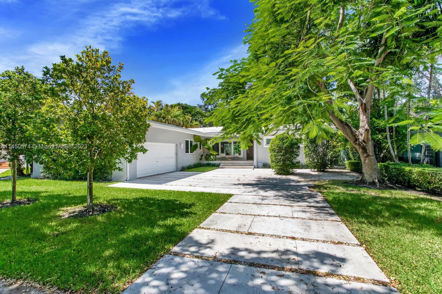 Stunning mid-century modern home on a quiet tree-lined street in Bay Heights - a walled North Grove community with 24/7 security patrol. Light-filled living spaces feature original terrazzo flooring & expansive windows throughout. Open concept floorplan w/ formal living, dining & family room + large flex space (can be converted to 4th BR). Major updates include: all plumbing & electrical, custom closets & all impact glass. Chef’s kitchen offers wood cabinetry, stone countertops, high-end appliances, dual zone-140 bottle wine refrigerator, cooking island & separate breakfast area.  Floor to ceiling sliding glass doors open to ultra-private garden & tranquil pool. Enjoy nearby bayfront parks and shopping & dining in the historic Grove village. Minutes to downtown, Key Biscayne & the Beaches.