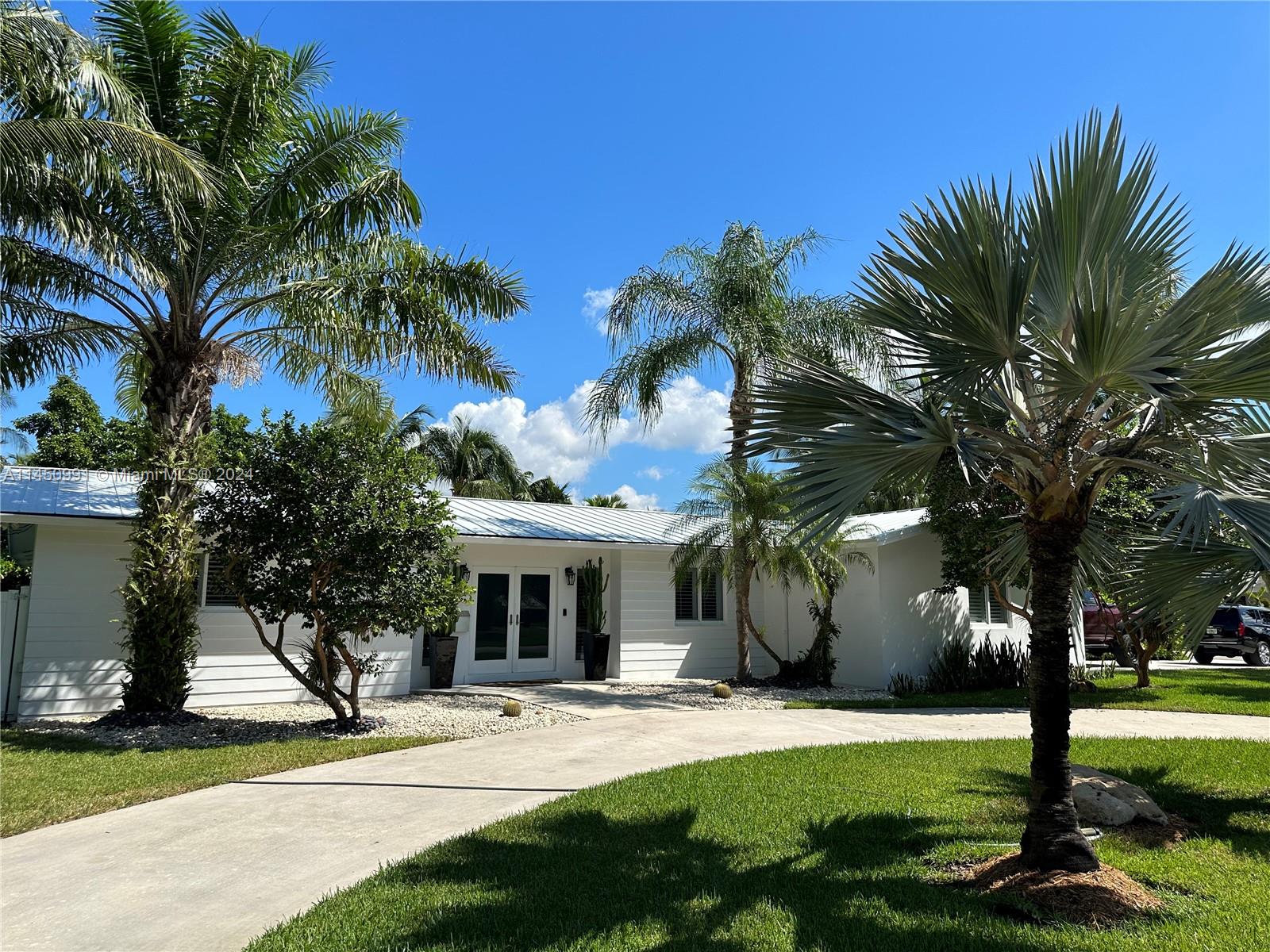 This beautiful and immaculate corner lot home in North Palmetto Bay has been updated with all impact windows and doors. Also, a new metal roof was installed in 2016. This home is situated in a very quite, and peaceful corner with amazing curb appeal and lots of privacy to enjoy your back yard and beautiful pool. Very close to Coral Reef Park, and school. New Kitchen appliances, fairly new washer and dryer, and both A/C compressors are relatively new as well. You are also close to great schools, both private and public. Close by you have the world renowned Lifetime Gym and fantastic dining as well. Come see this home and make it your own.