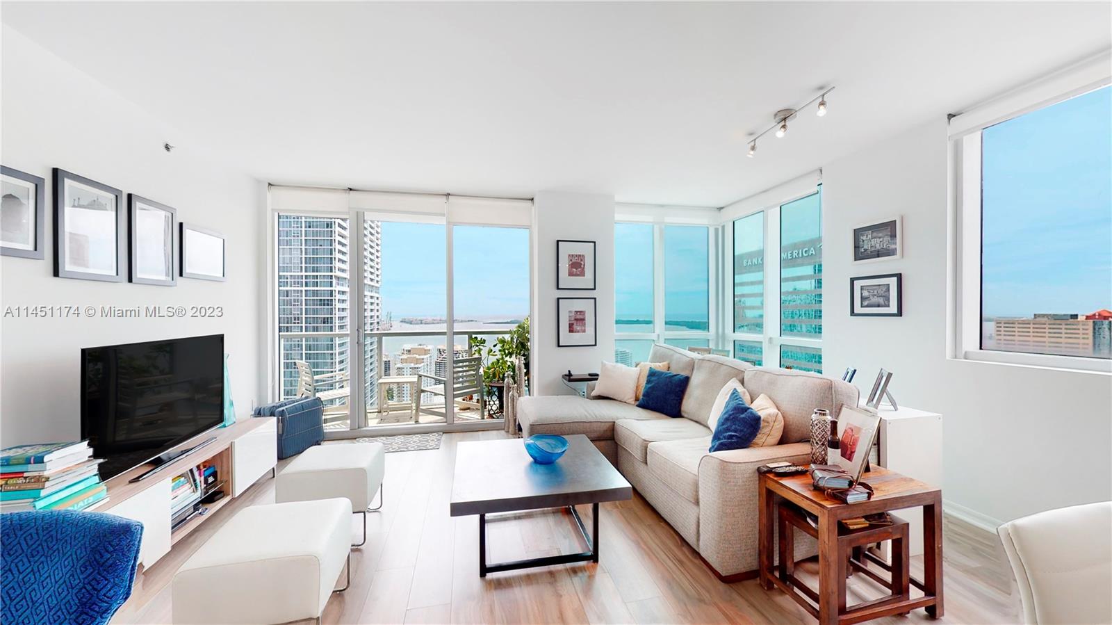 Enjoy the best of what Brickell has to offer – stunning water and city views from the 40th floor of this beautiful, move-in ready 2 bedroom/2 bath corner unit, most desirable floor plan in the building. Updated flooring, new cooktop/oven. Easy access to the heated rooftop pool from the unit. Building offers variety of great amenities, 24/7 security on site, valet parking for visitors. Short walk to Brickell City Centre, Mary Brickell Village, and Downtown. 20 min drive by a car to the airport, Design District, Arts & Entertainment District, Wynwood and Miami Beach. Make your Miami living dream come true! 
Matterport and video of the unit are available.