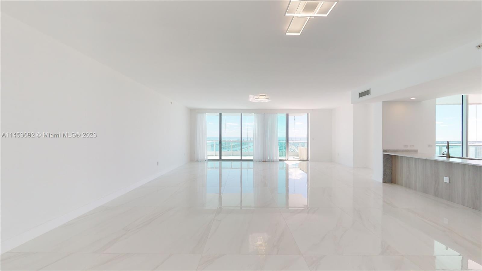 Experience pure luxury in this 3-bedroom, 3.5-bath condo at 900 Biscayne Blvd. With panoramic views of the Bay, Port of Miami, and beaches, this 2,647 sq ft unit features new porcelain floors, custom closets, and an expansive terrace. Enjoy 24hr concierge, two pools, a gym, spa, theater, and more. Central location near Museum Park, Adrienne Arsht Center, and FTX Arena. One parking space included.